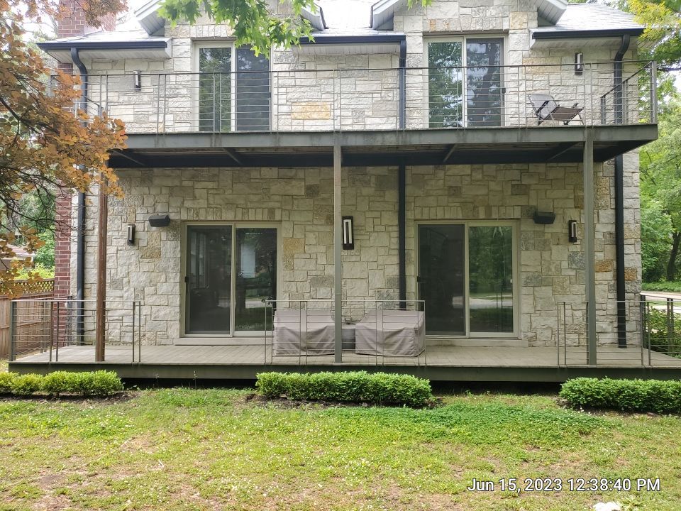 Highland Park, IL Bluestone, concrete,  Trex deck cleaning by Northern Power Washing LLC.