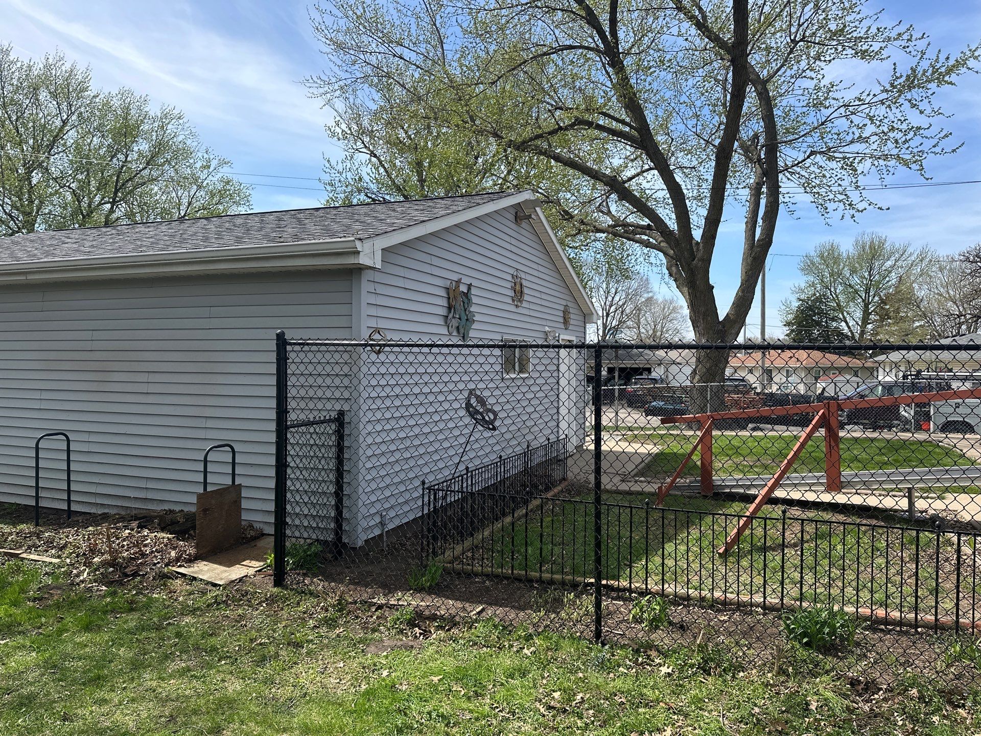 Black Chain Link Fence Installation for Waterloo Residential Backyard by Perfect Picket Fence and Stain