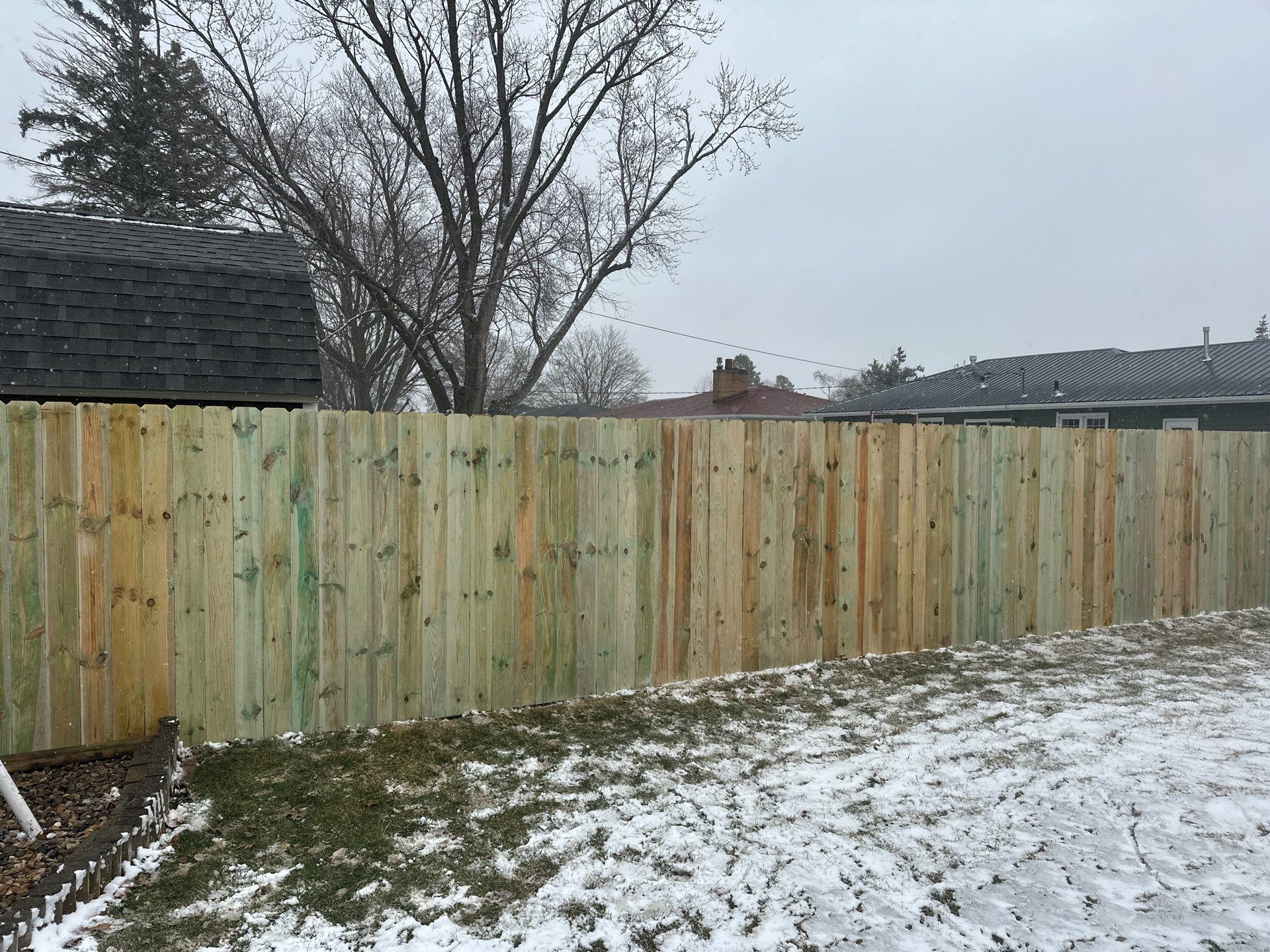 Pressure-Treated Wood Privacy Fence Replacement in Waterloo by Perfect Picket Fence and Stain