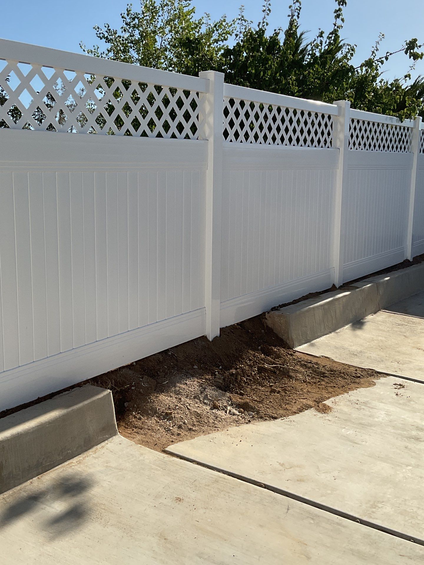 Lattice Vinyl with Privacy Vinyl Fence by Fence Guys Inc.