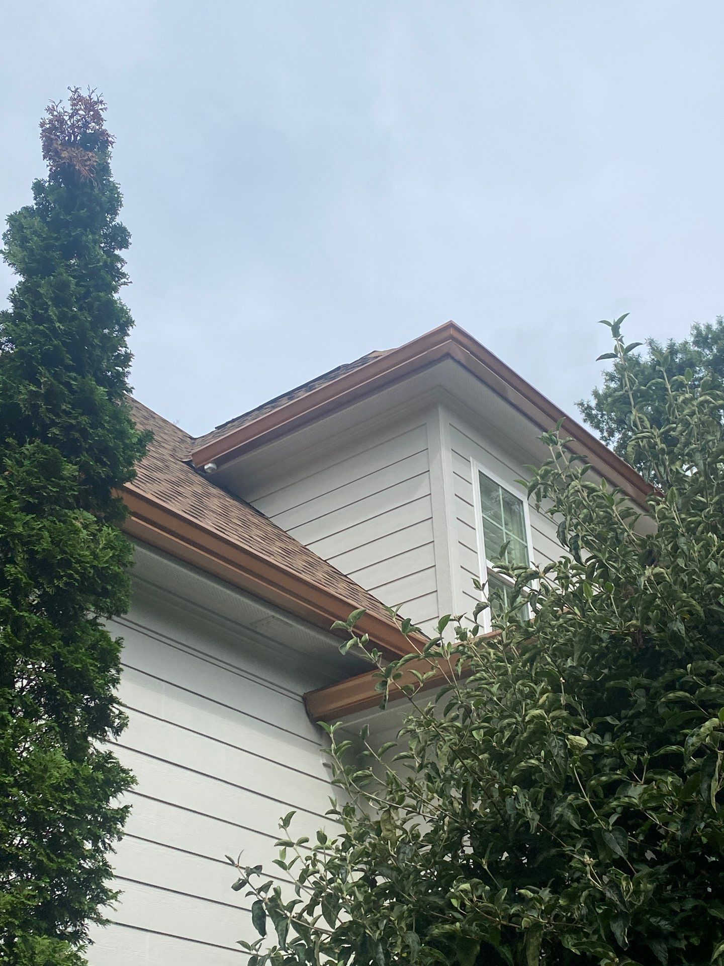 Roof Replacement - GAF Timberline HDZ Shakewood - 6” coppertone seamless gutters by Pro Performance Roofing