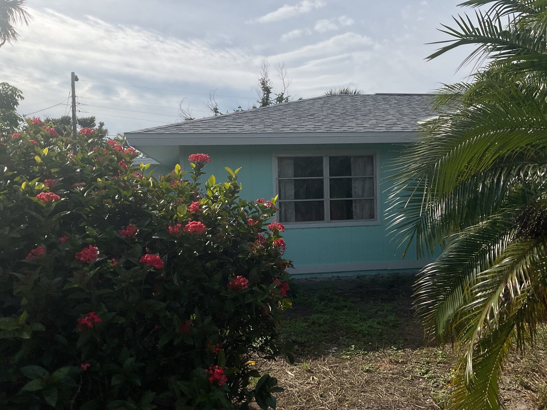 White Seamless Gutters Installation in Sanibel FL by Gutter Professors