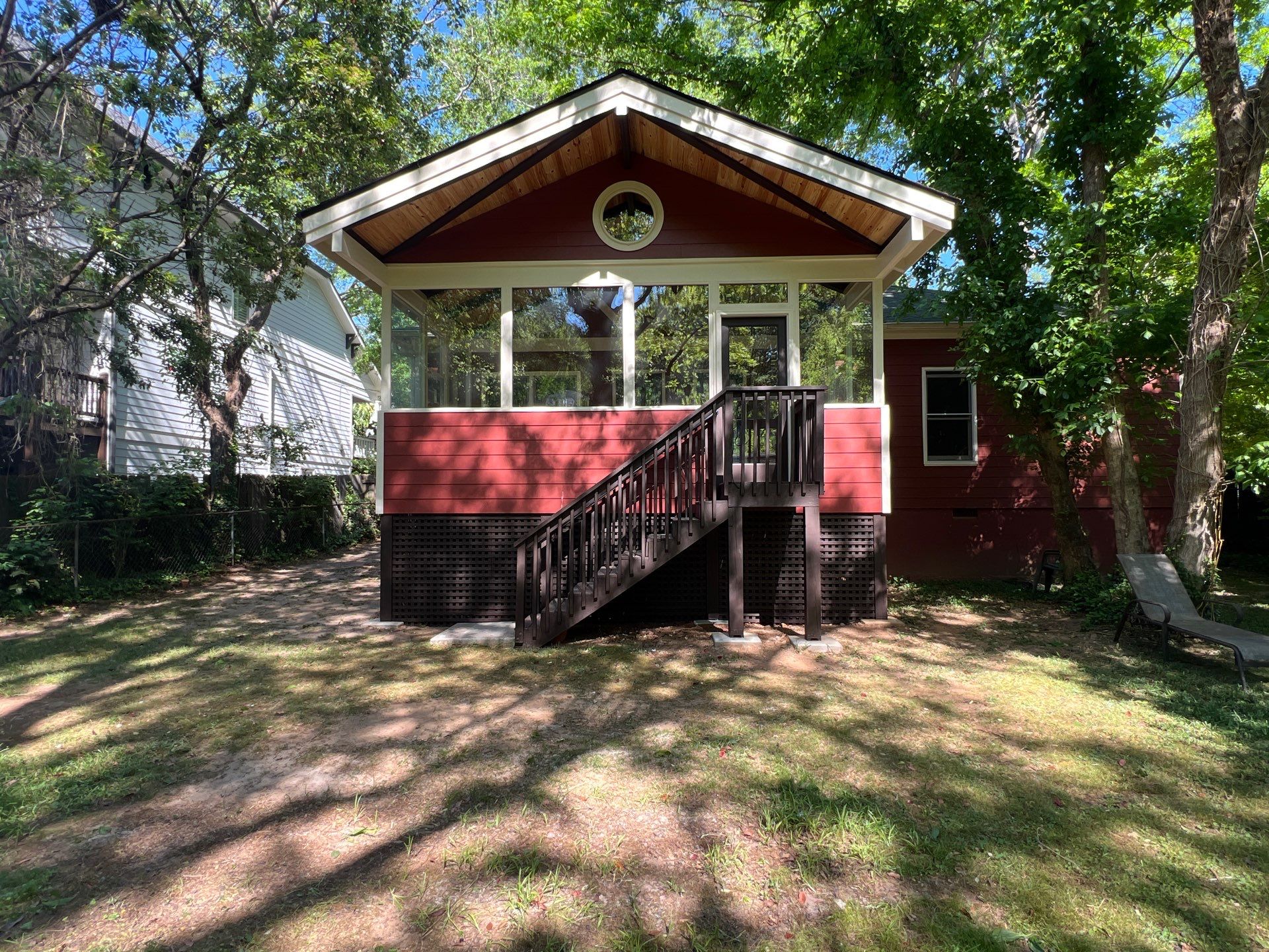 Elevated Screened-In Porch Addition with Vaulted Tongue-and-Groove Ceiling by Swift Home Renovations