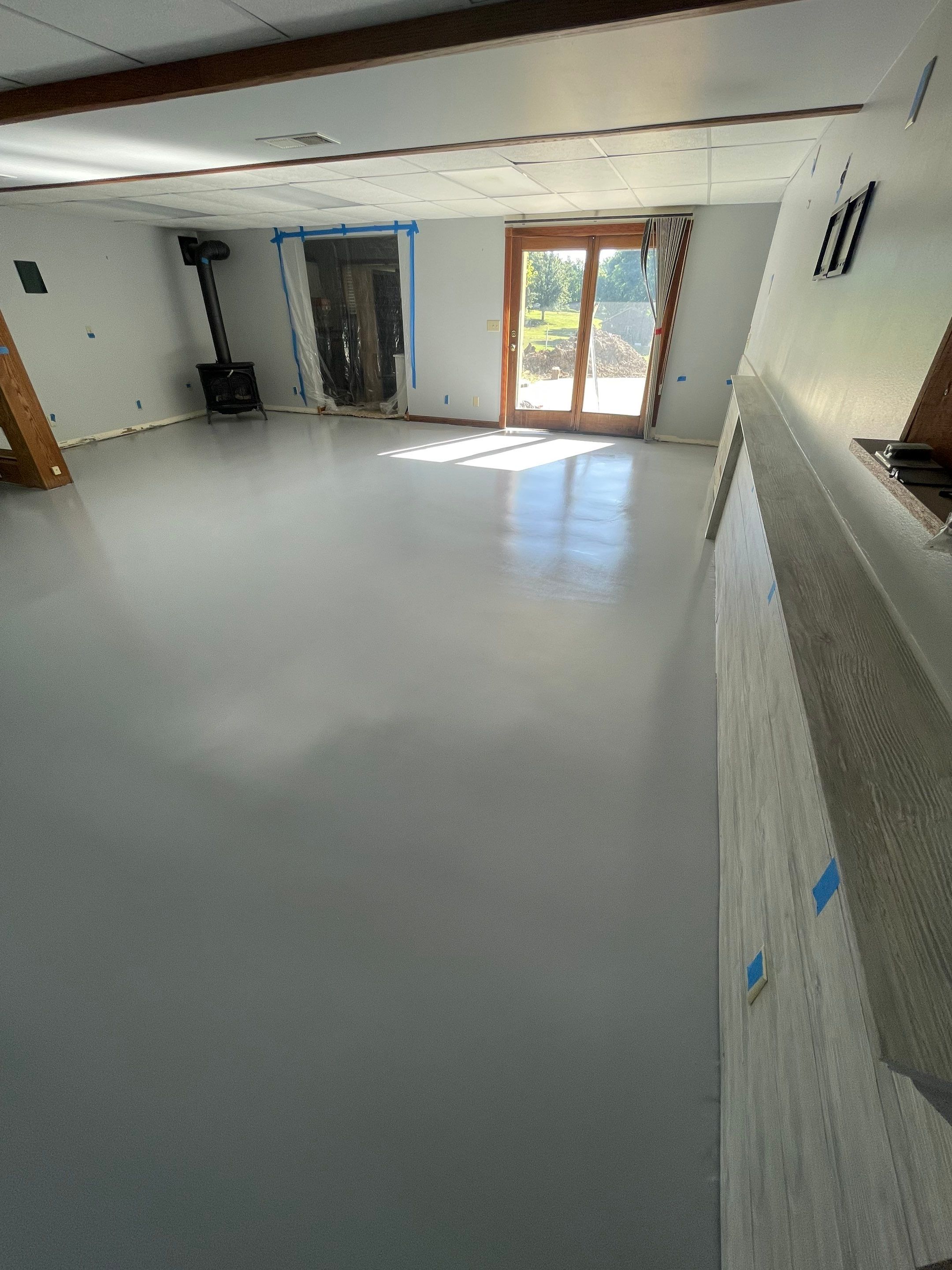 Solid Color Concrete Floor Coating for Renner Basement by Select Painting, Coatings & Garage Cabinets