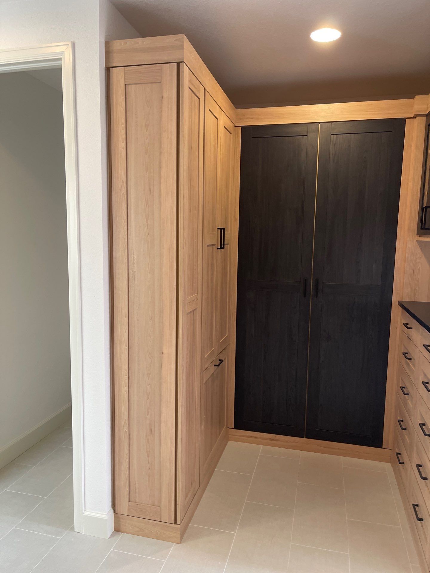 Two-Tone Closet with matching Mudroom + Laundry Room by Concept 32, Inc.