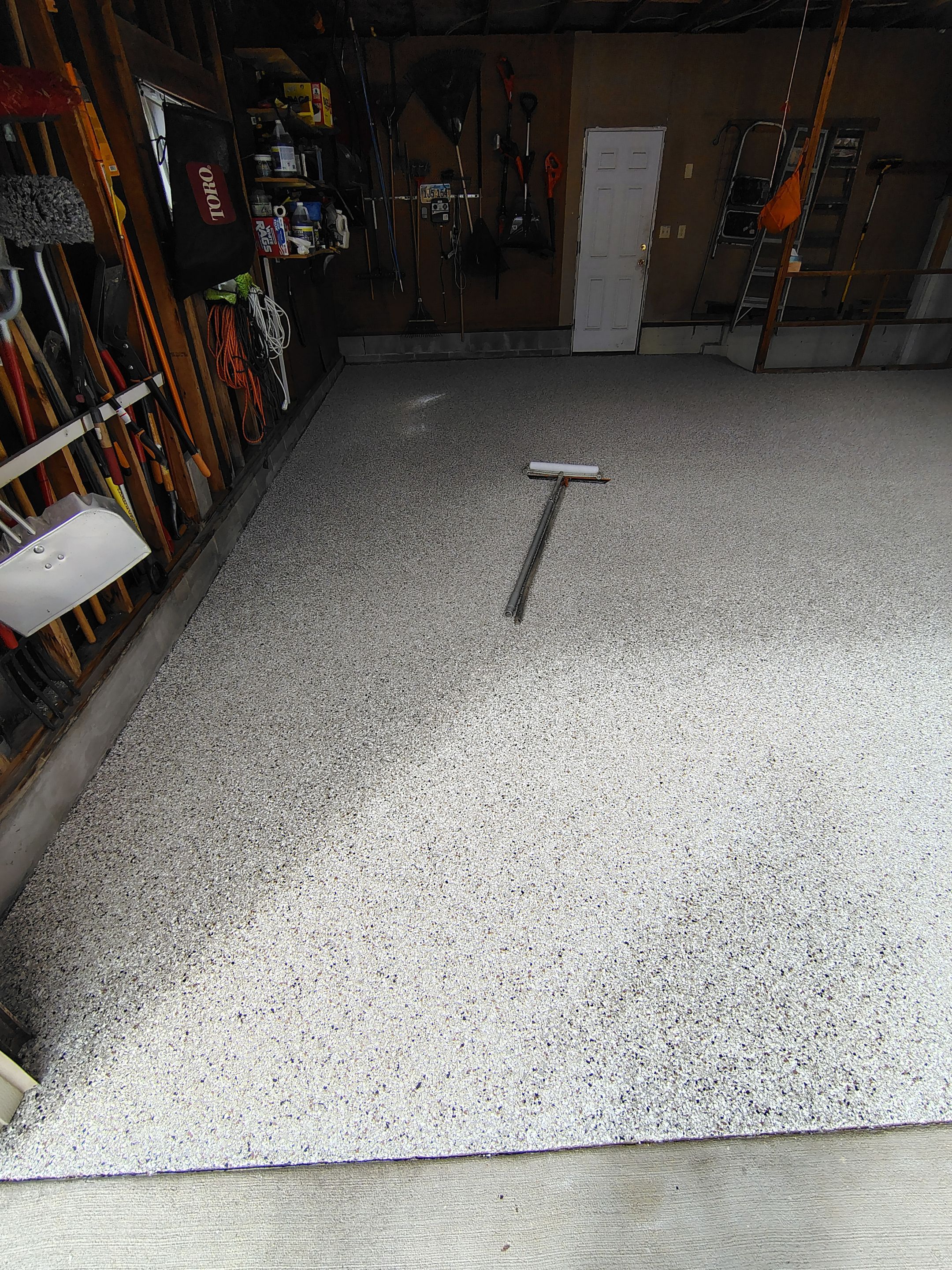 Sioux Falls Garage Epoxy Floor Installation and Concrete Crack Repair by Select Painting, Coatings & Garage Cabinets