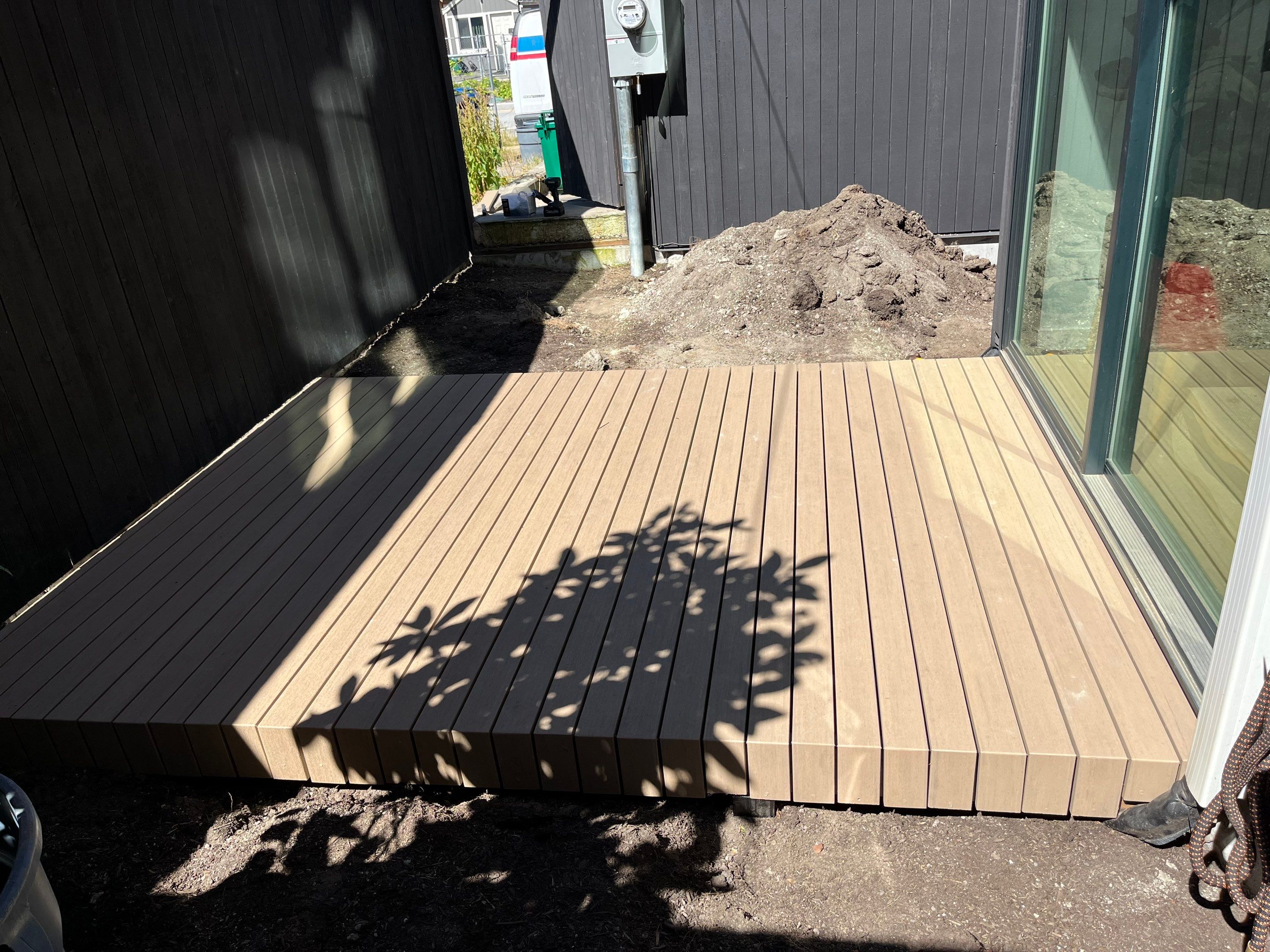 Modern Backyard Deck by Alki deck builders 