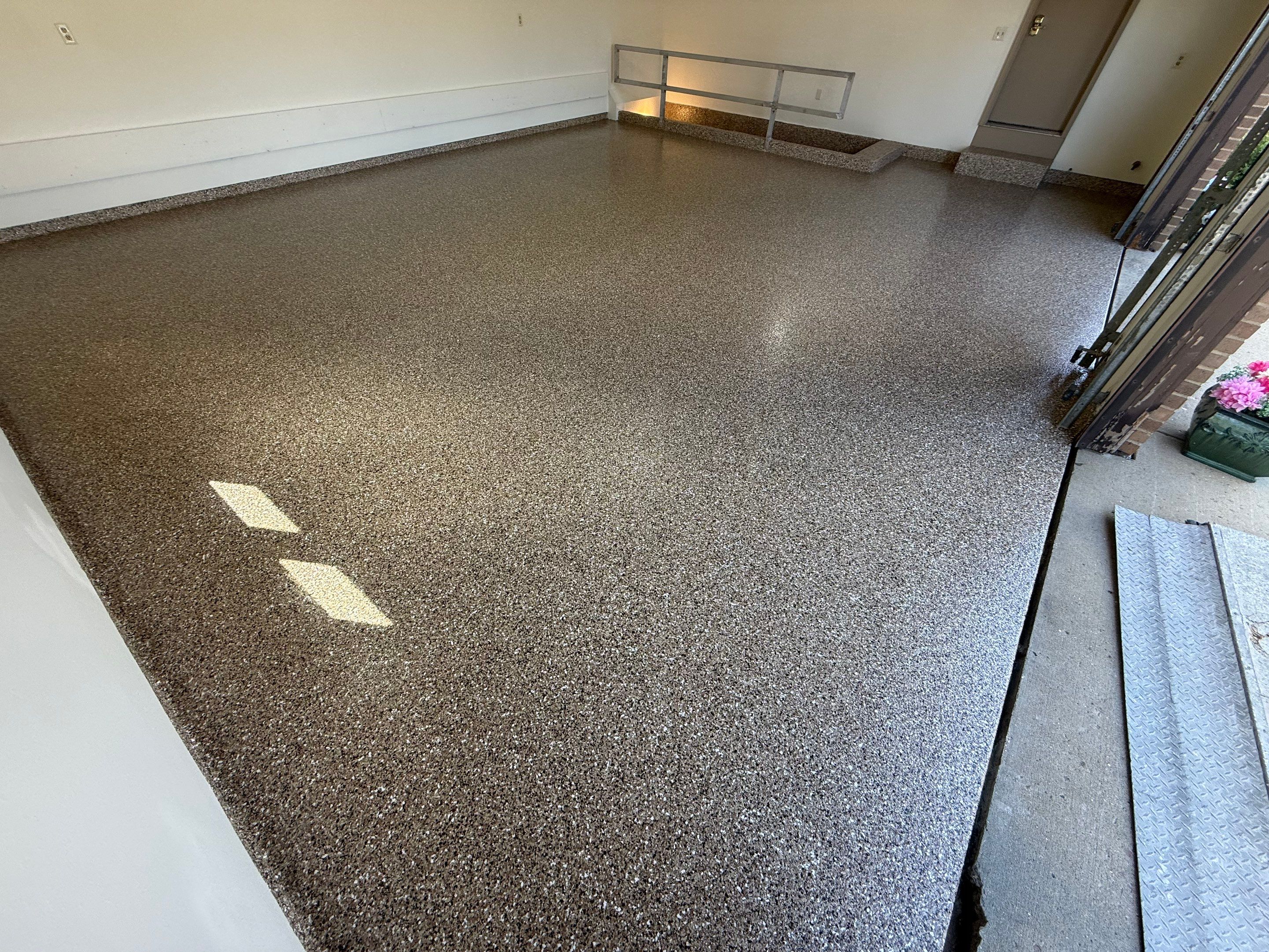 Custom Polyaspartic Garage Floor and Stairwell Coating in Pipestone by Select Painting, Coatings & Garage Cabinets