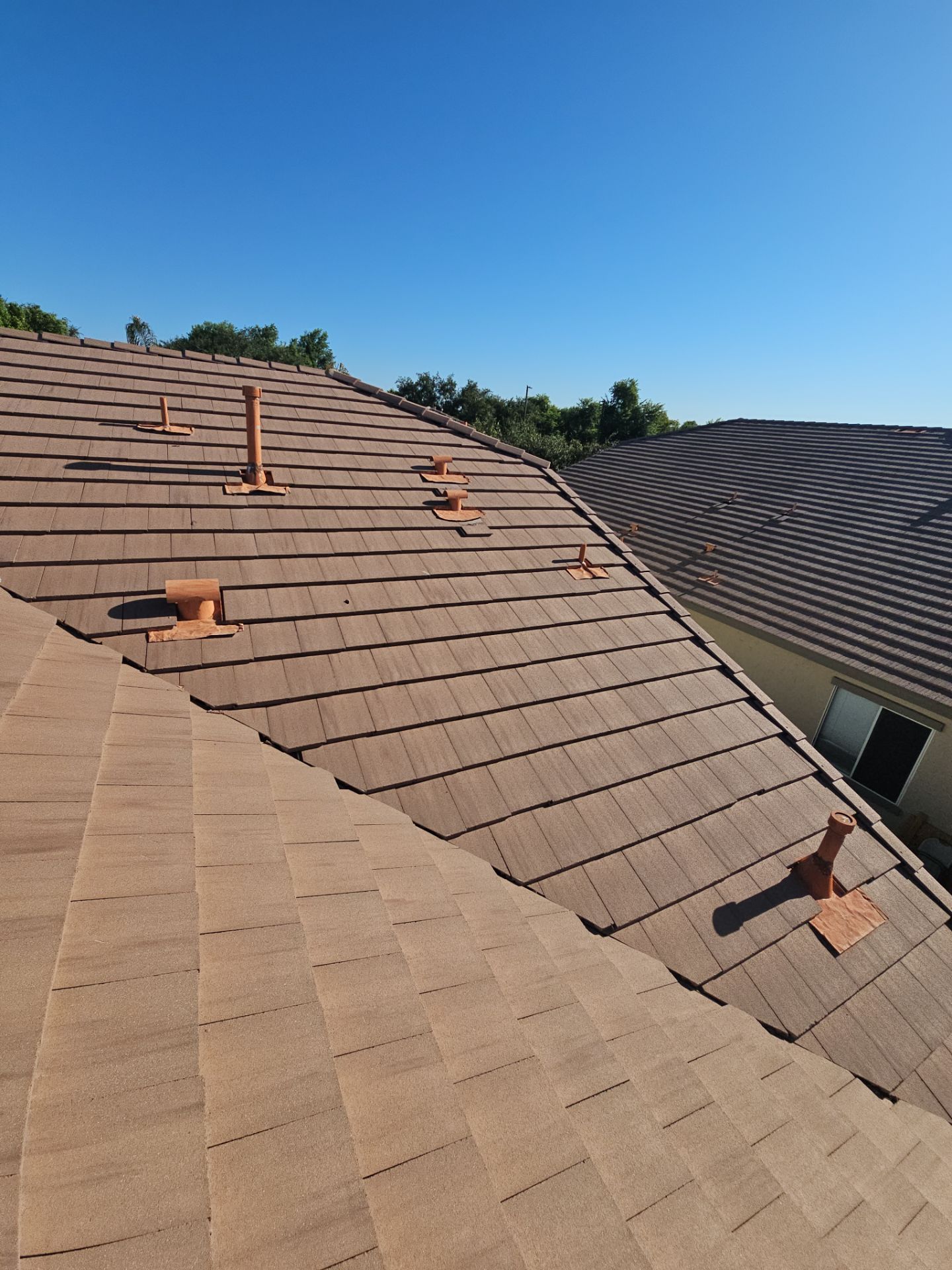 Residential Roofing Installation using Concrete Tile by Weather-Tite Exteriors LLC