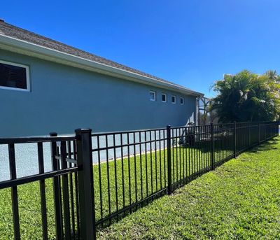 Aluminum Fence Installation using Black 3 Rail Aluminum Fence