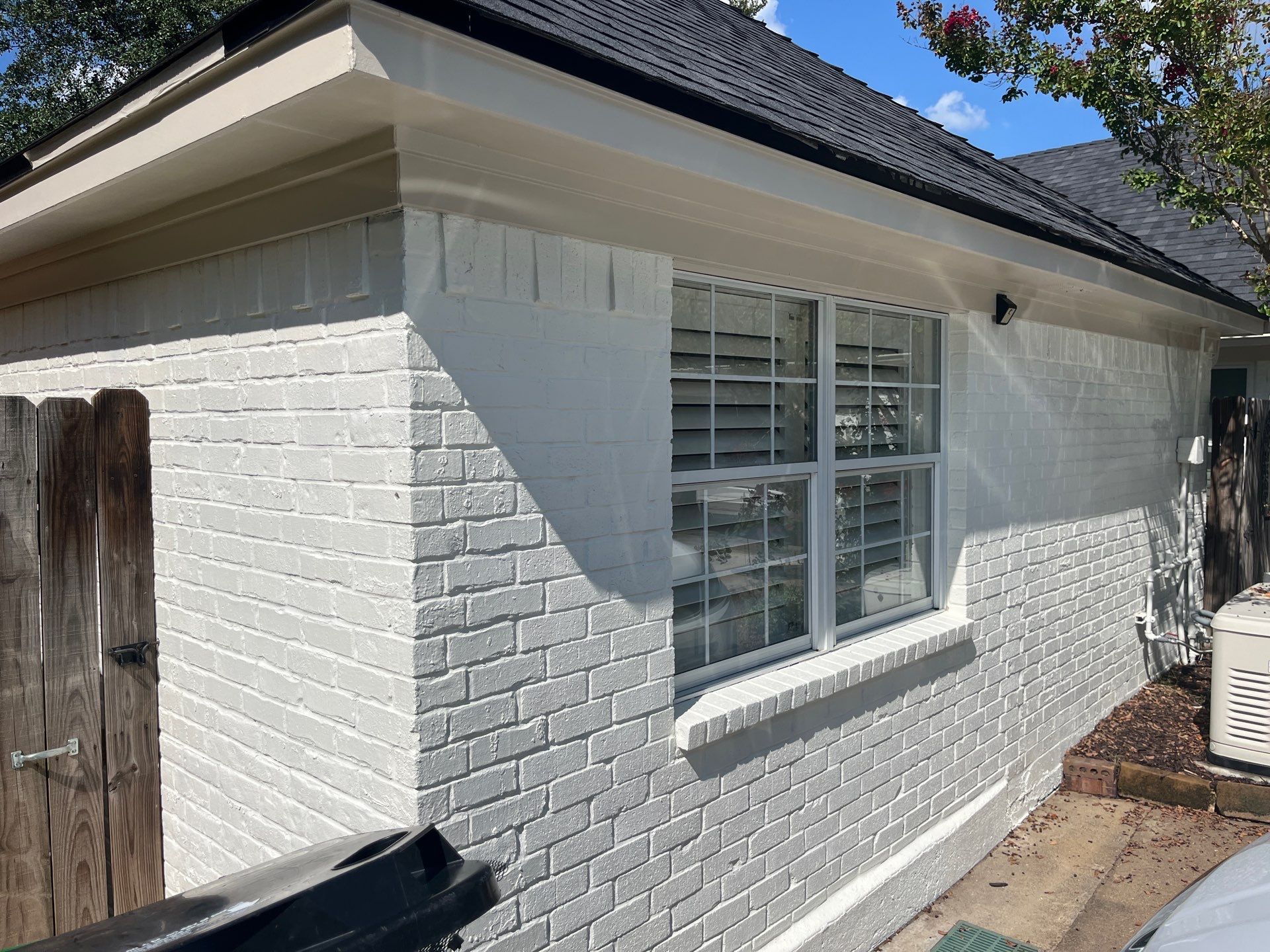 Exterior Painting in Tyler, TX | Brick House with White & Blue Finish by Quality Coats Painting