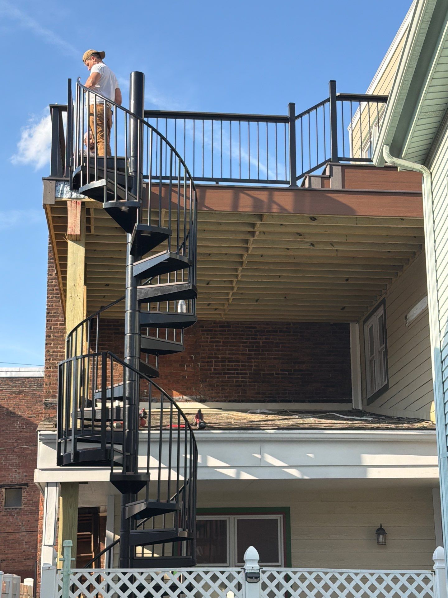 Elevated Multi-Level Composite Deck with Spiral Staircase in Pittsburgh by Cousins Roofing Siding & Decks