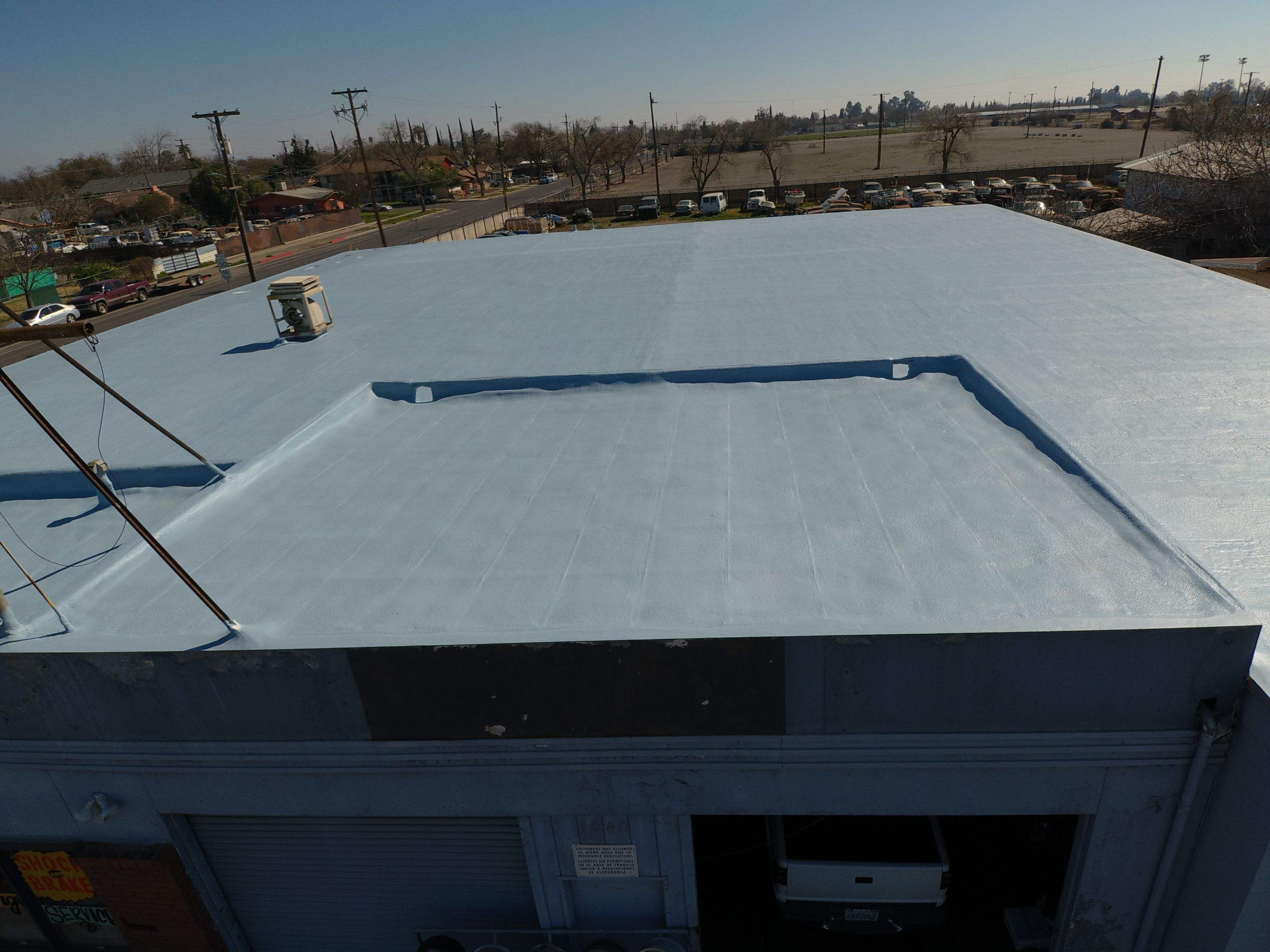 Spray foam and coatings using Conklin Benchmark/PUMA XL coatings and spray foam by Straight Edge Roofing Inc