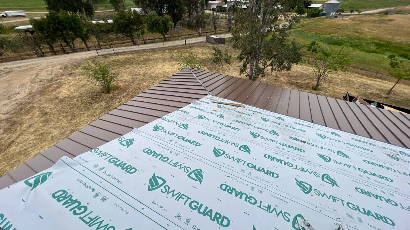 Metal roofing installation using Standing seam metal roofing system by Straight Edge Roofing Inc