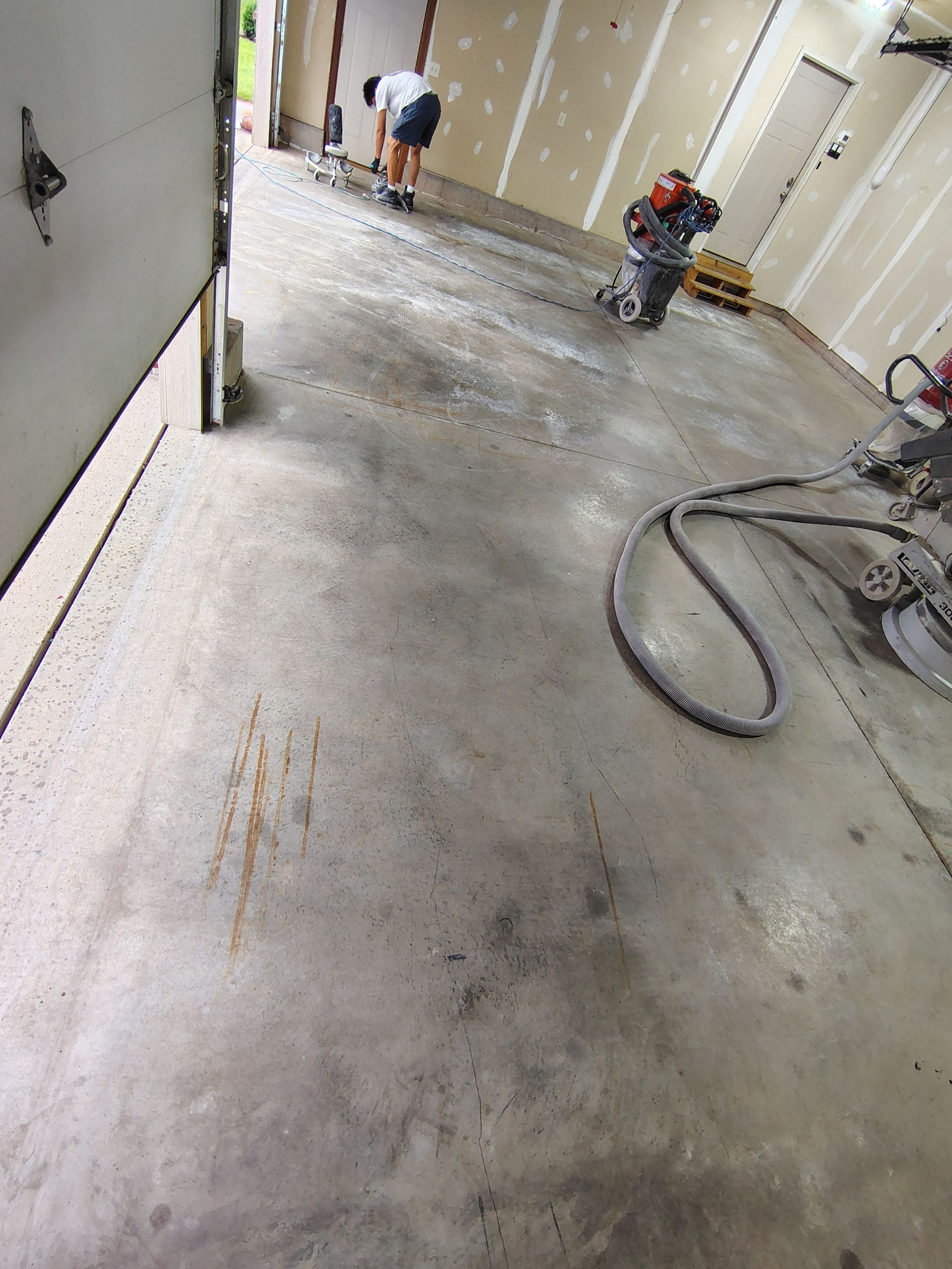 Multi-Car Garage Concrete Coating and Epoxy Finish in Sioux Falls by Select Painting, Coatings & Garage Cabinets