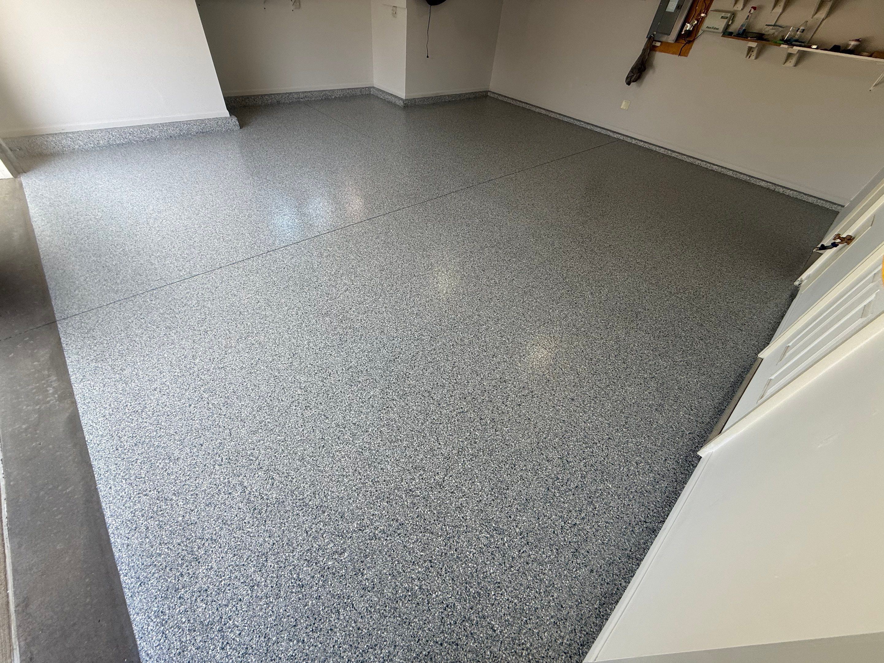 Decorative Chip Epoxy Floor Coating Installation in Sioux Falls by Select Painting, Coatings & Garage Cabinets
