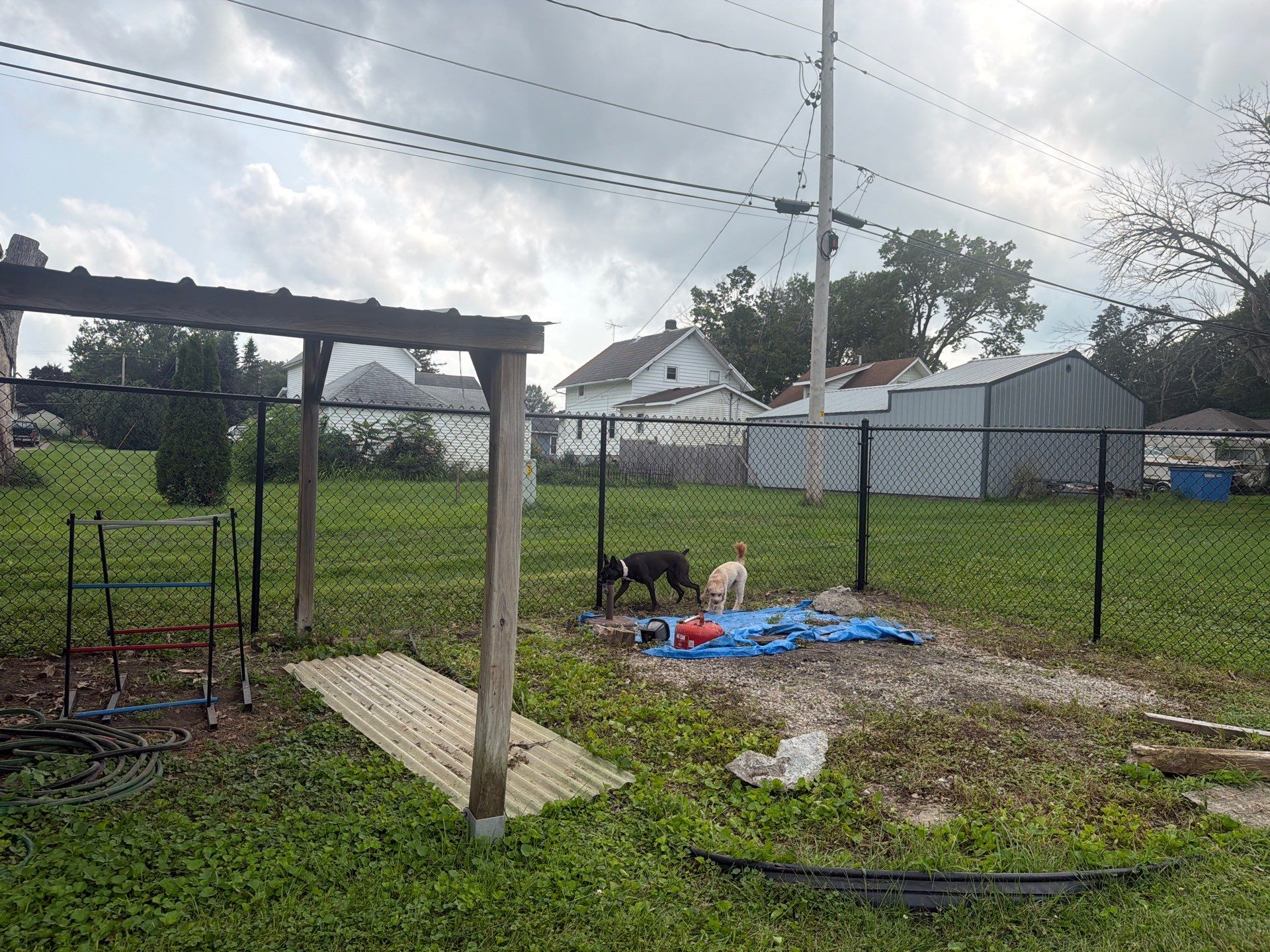 Residential Black Chain Link Fence Installation in Reinbeck by Perfect Picket Fence and Stain