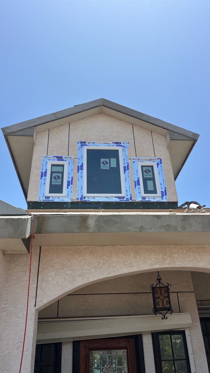 Installing Windows on a Submarine  by Bayfront Roofing and Construction