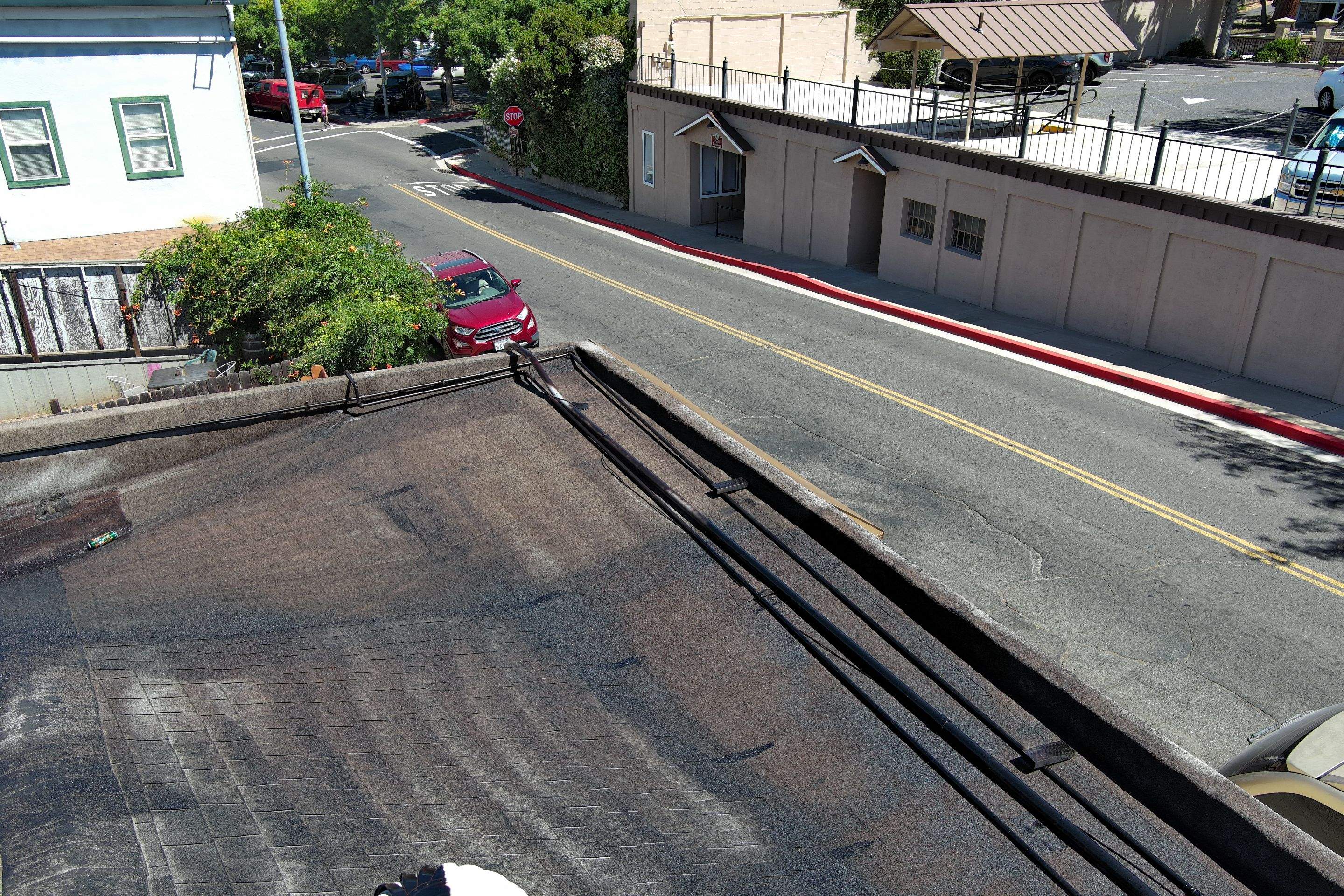 Foam and coatings on commercial roof by Straight Edge Roofing Inc