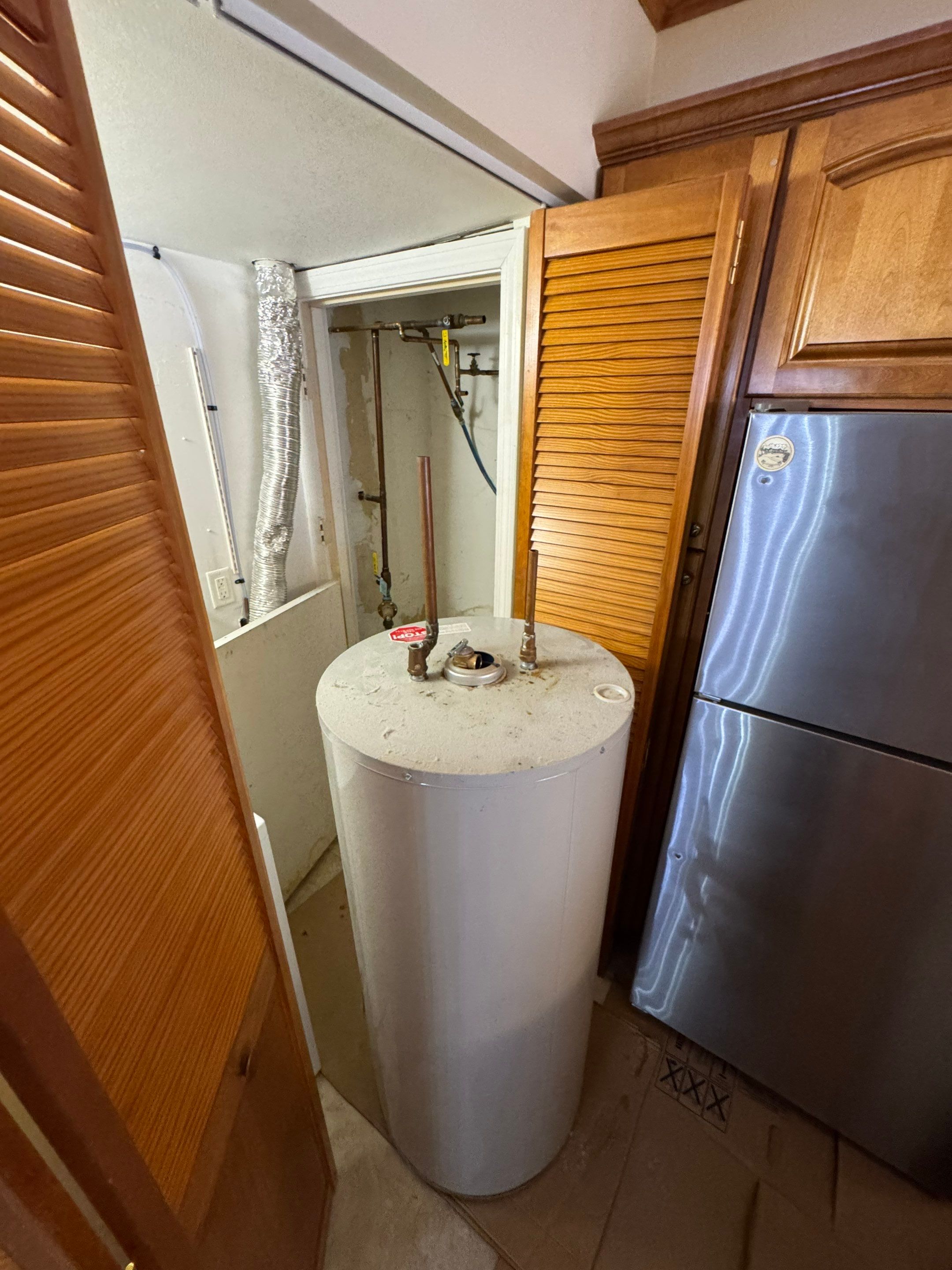 Closet Water Heater Replacement by Stake Plumbing and Heating
