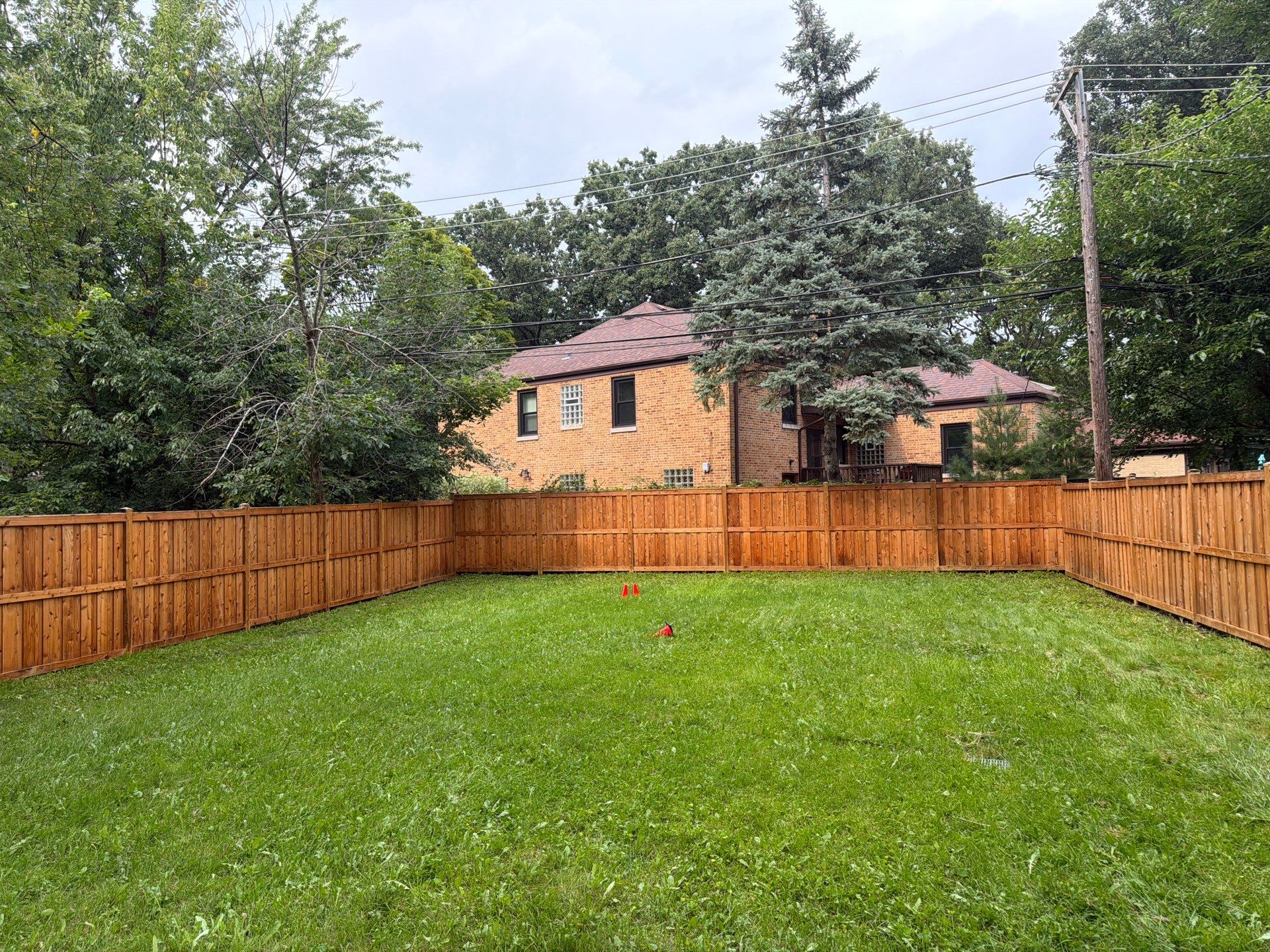 Wood fence cleaning and sealing by Northern Power Washing LLC.
