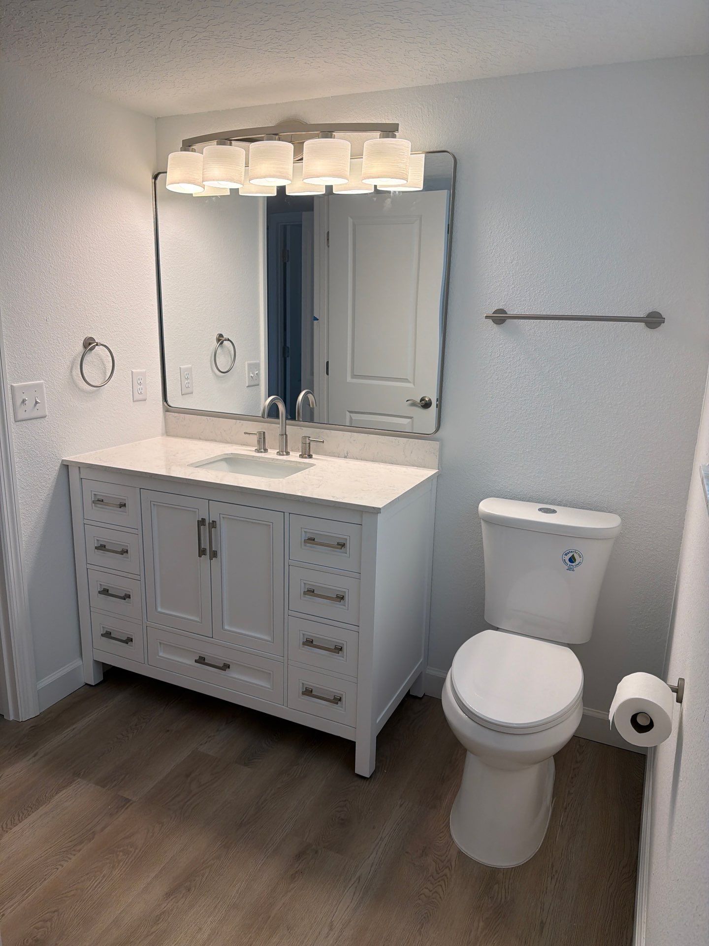 Full Condominium Remodel Featuring Aubrey Oak Flooring In Daytona Beach by Acies Renovations