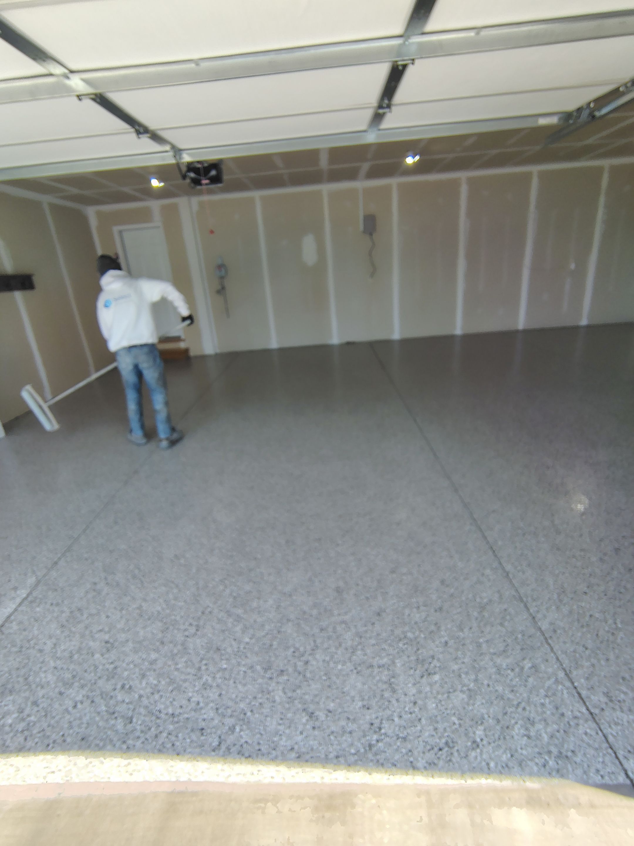 Epoxy Garage Floor Coating with Decorative Flake in Harrisburg by Select Painting, Coatings & Garage Cabinets