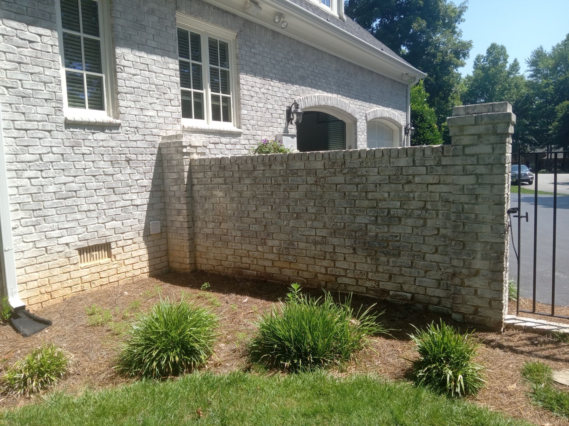 exterior brick wall pressure washing to remove dirt buildup and improve appearance