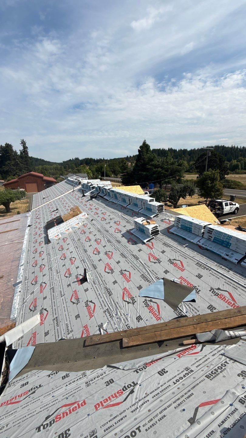 Residential Roof Replacement with Metal Accents by Orezona Building & Roofing Company, Inc.