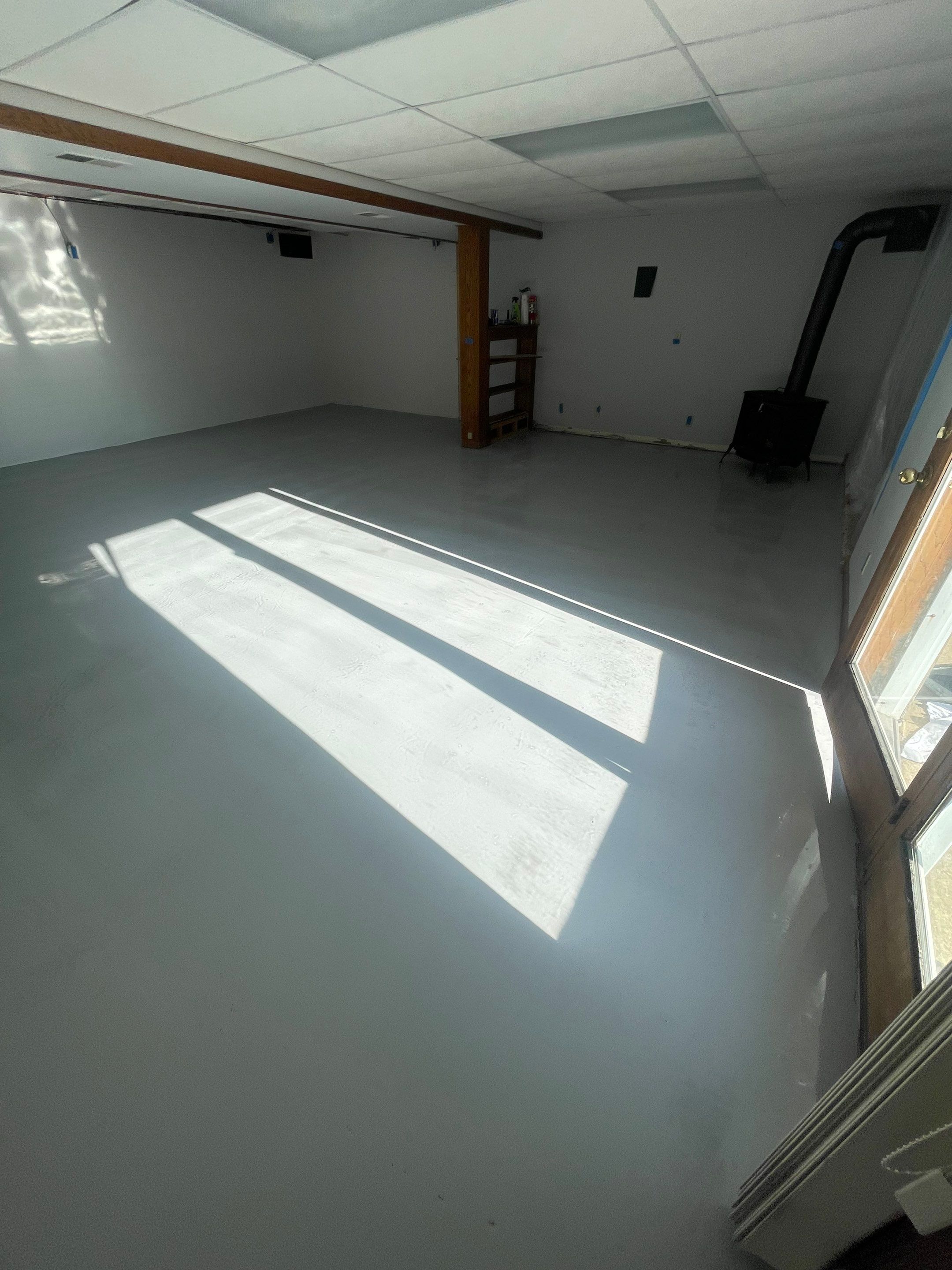 Solid Color Concrete Floor Coating for Renner Basement by Select Painting, Coatings & Garage Cabinets