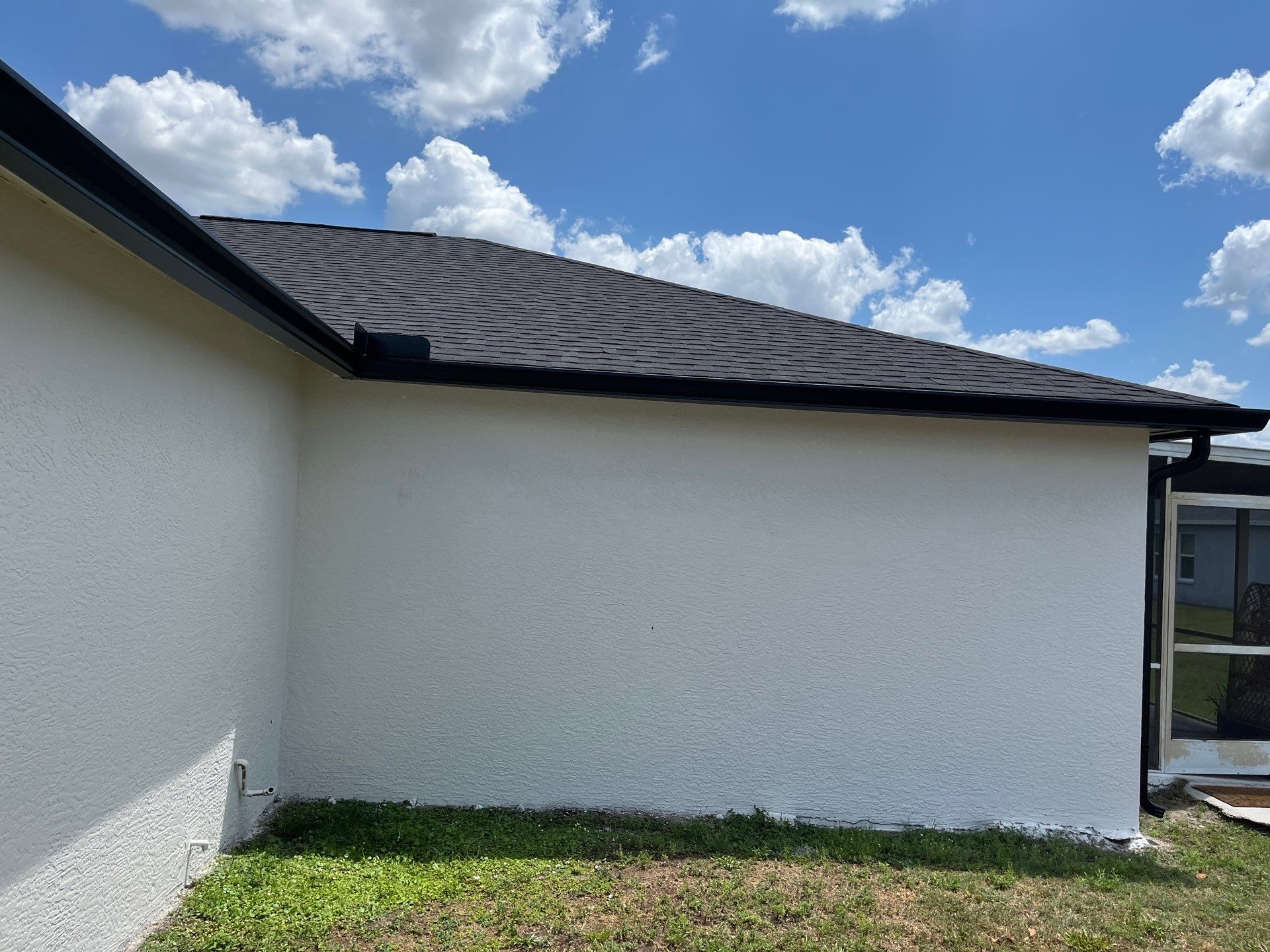 Black Seamless Gutters and Downspouts in Fort Myers FL by Gutter Professors