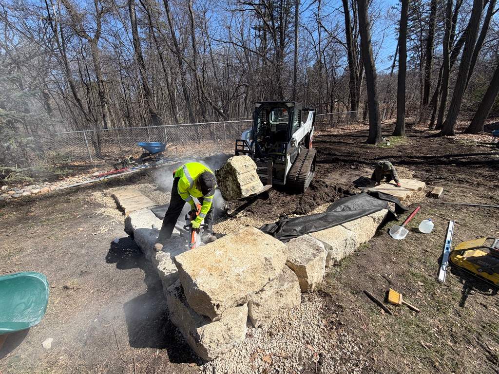 Limestone Boulder Wall  by Sota landscaping