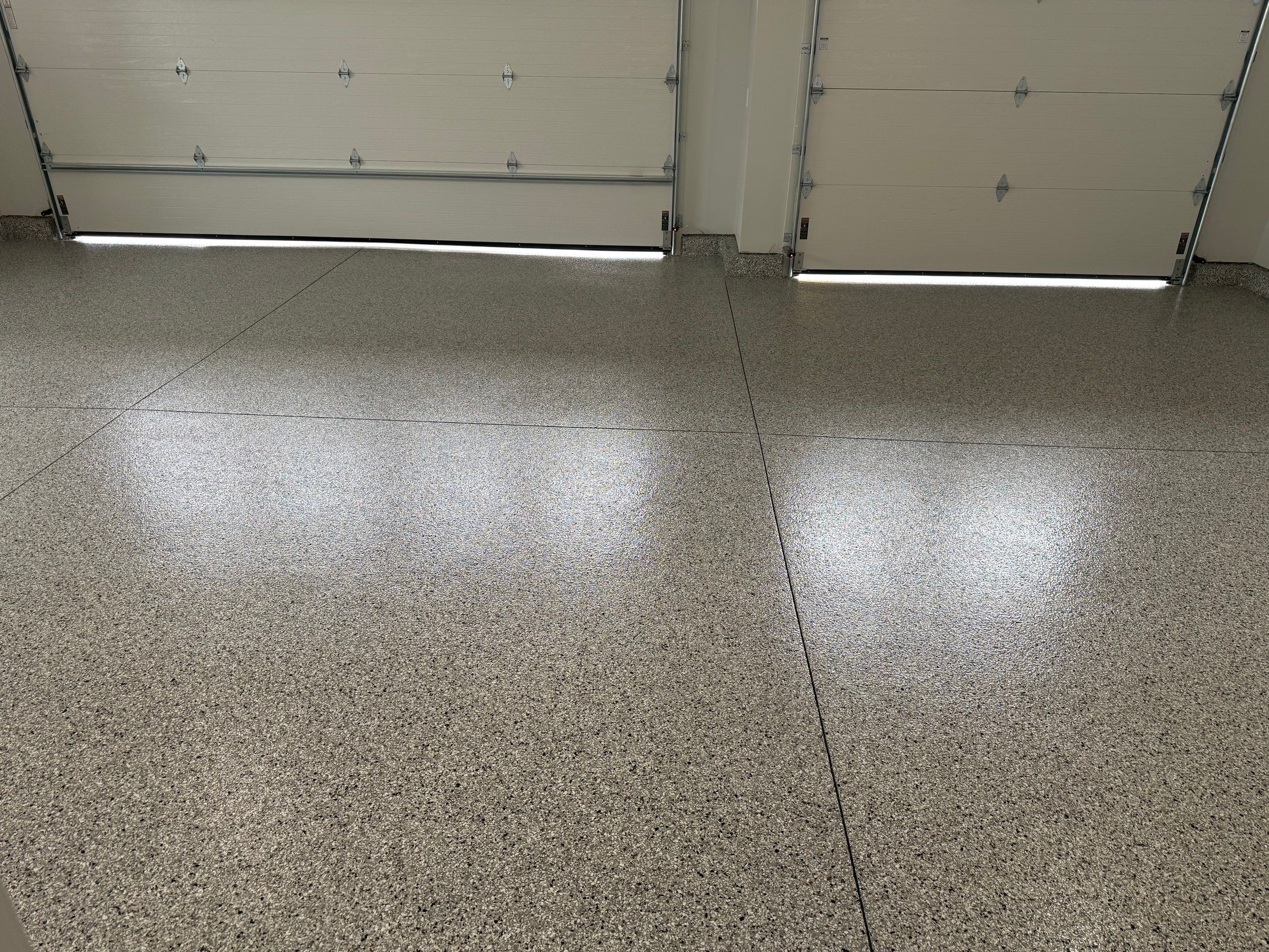 High-Gloss Epoxy Flake Garage Floor Coating in Brandon by Select Painting, Coatings & Garage Cabinets