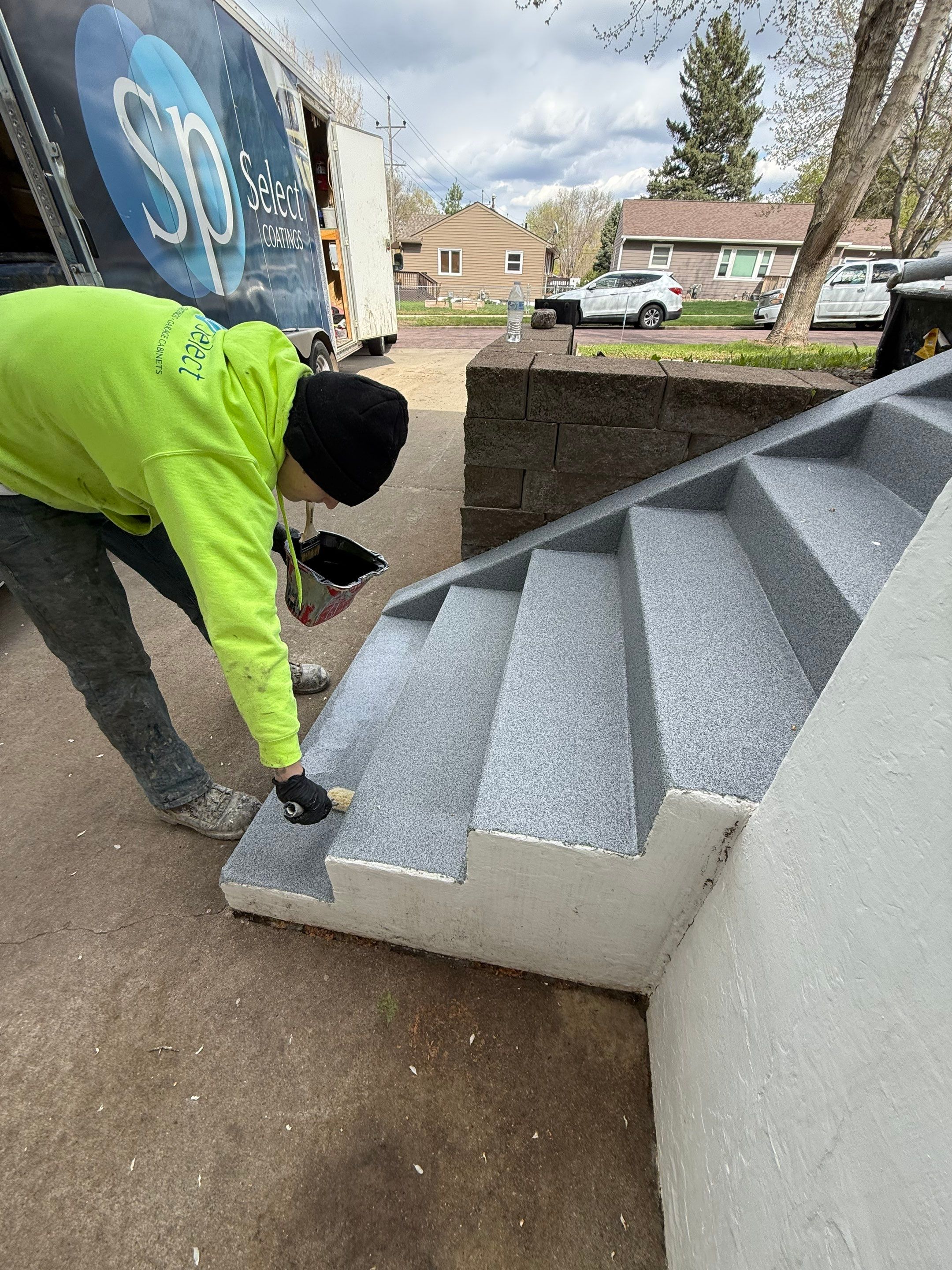 Grey Polyaspartic Porch and Stair Resurfacing in Sioux Falls by Select Painting, Coatings & Garage Cabinets