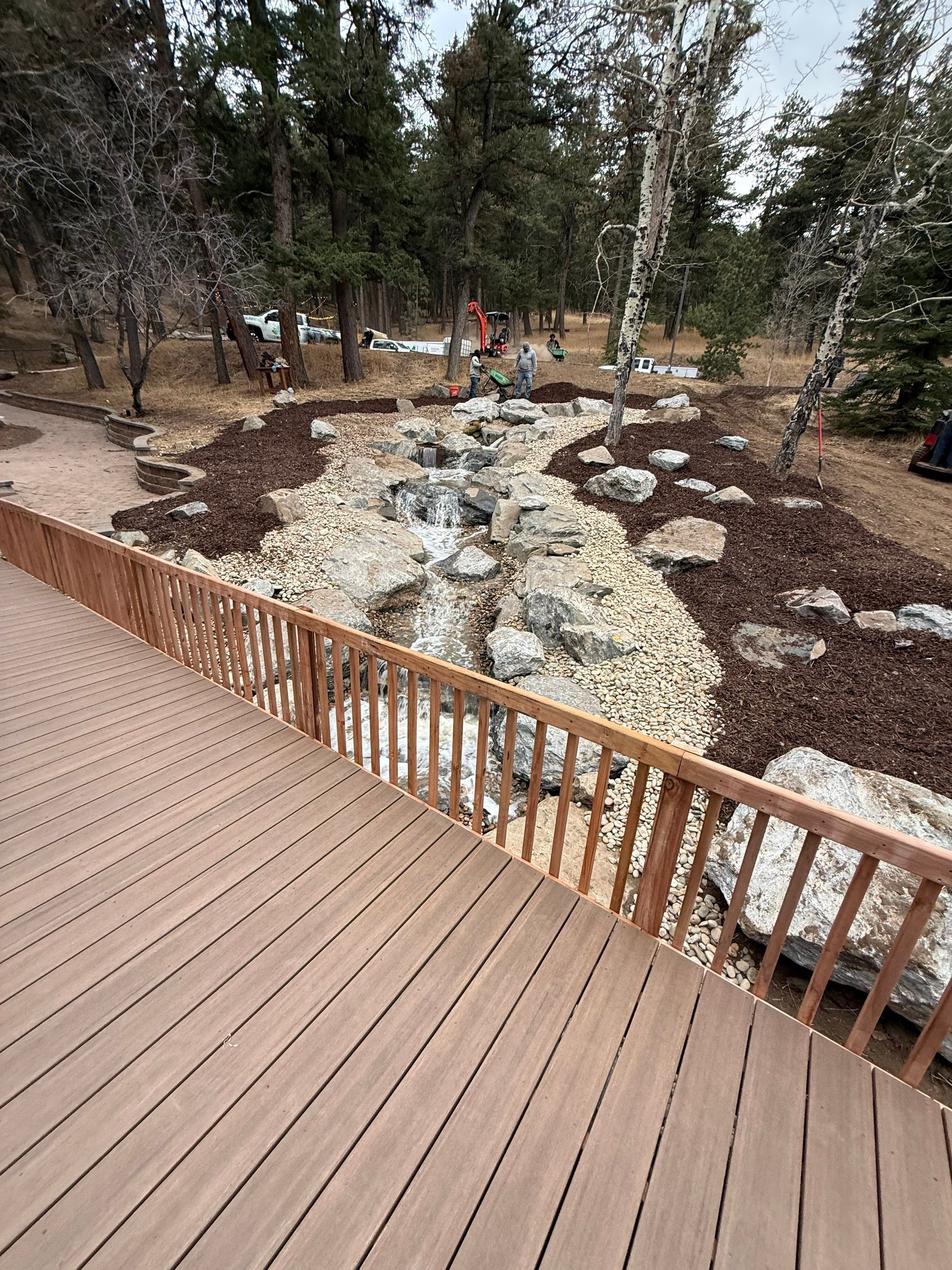 large waterfall and deck by JRM landscape & design
