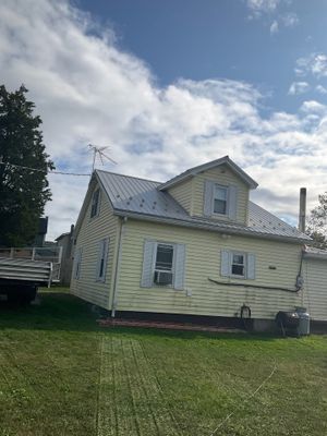 Metal Roof Replacement Using Ash Gray Panels in Tower City