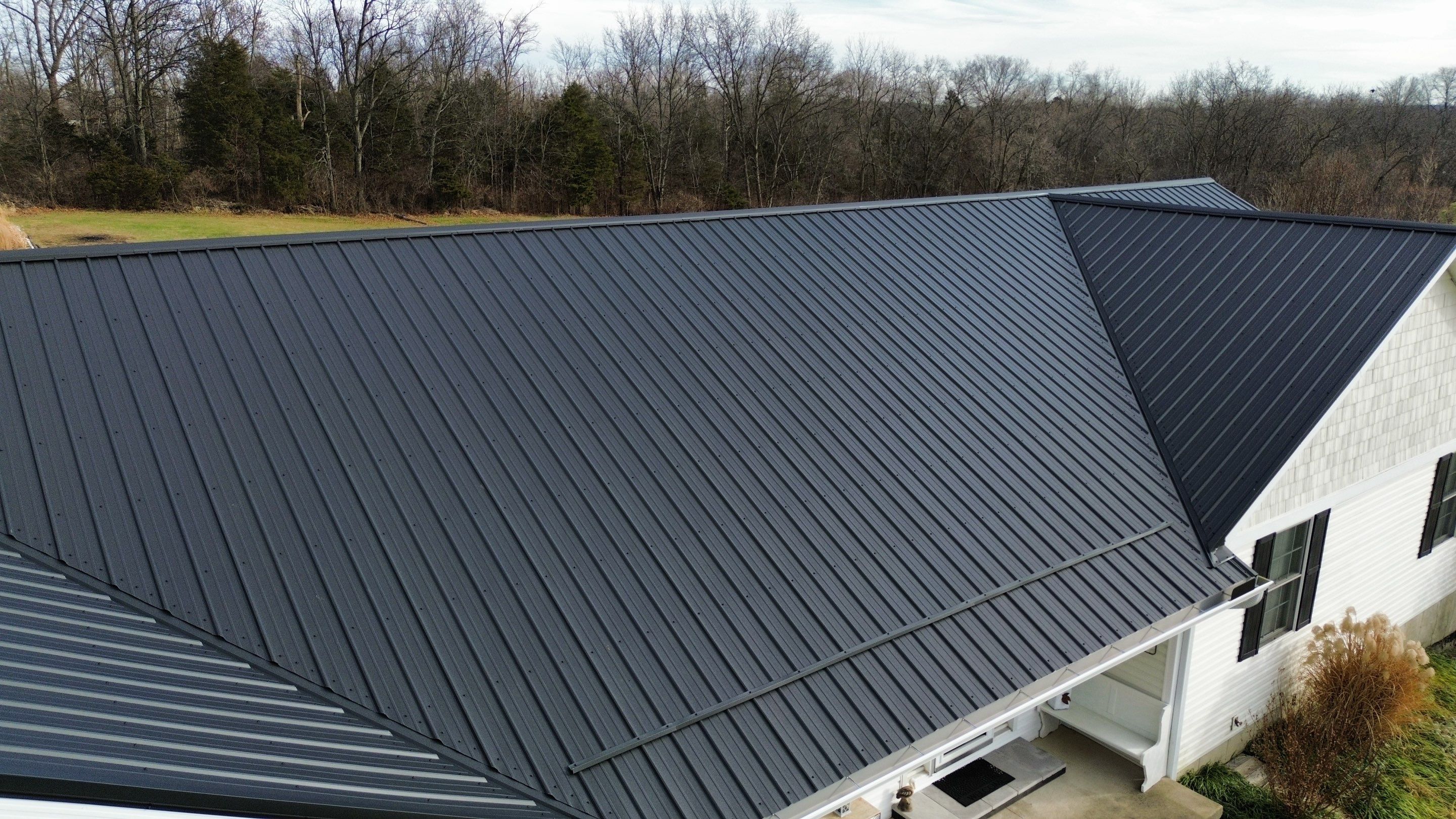 Residential Roofing Installation using Performance Panel Metal - Frost Black by RoofX 