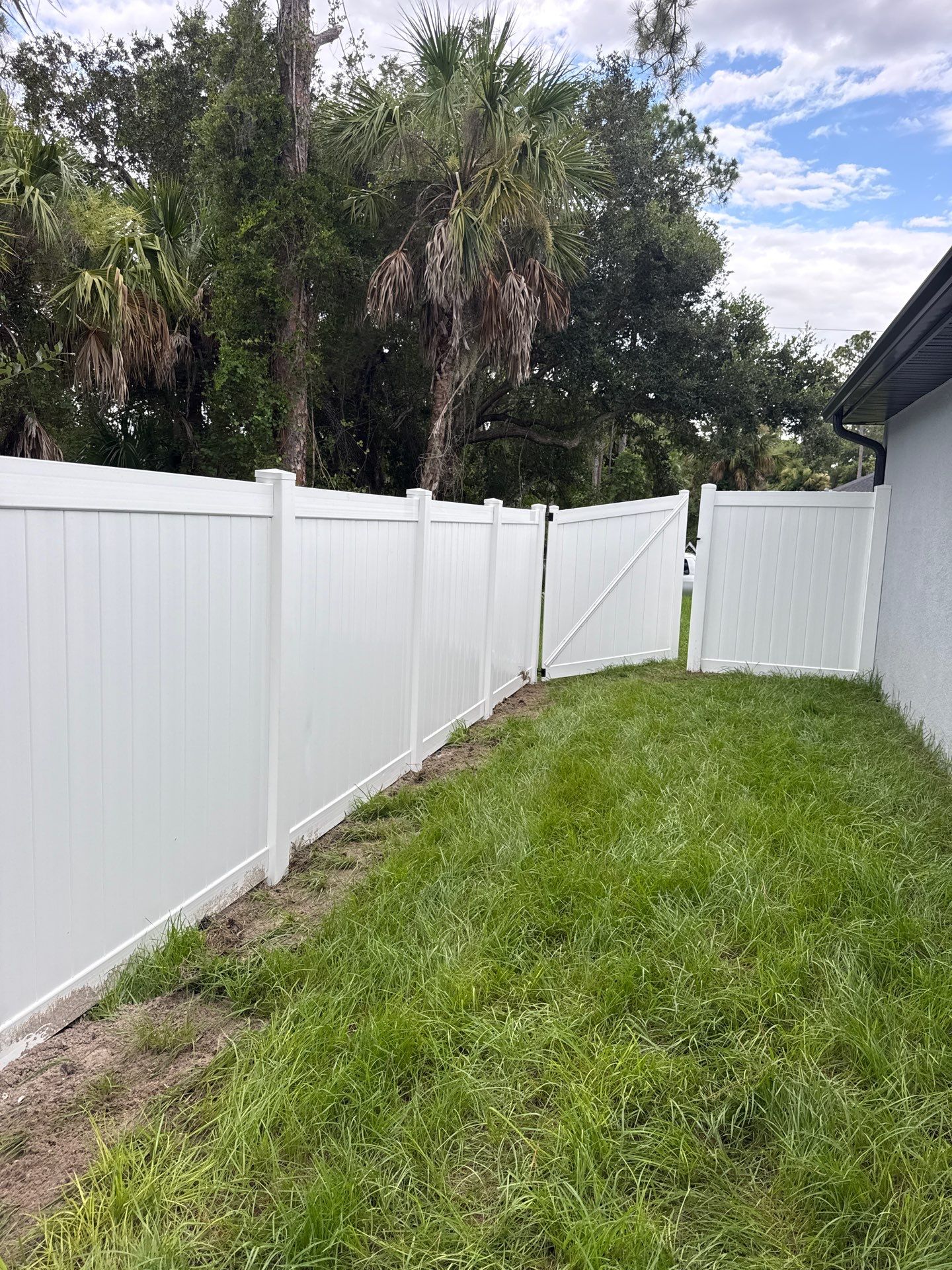 White Vinyl Privacy Fence Installation in North Port by True Fence LLC