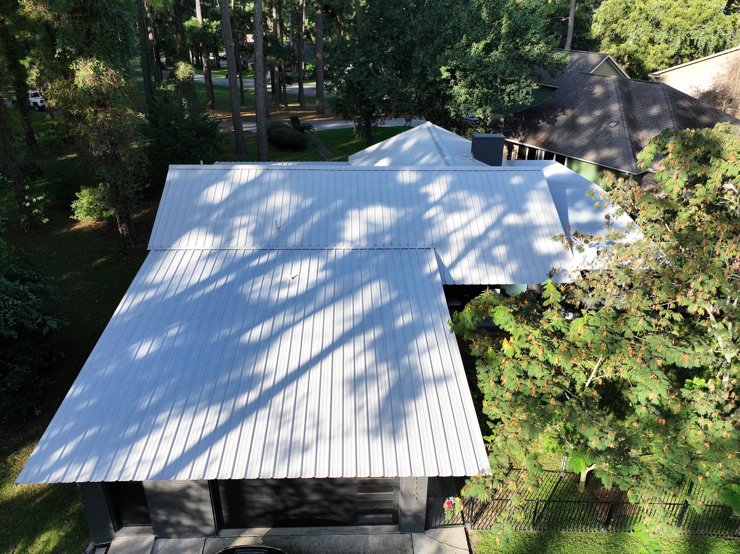 White Standing Seam Metal Roof Replacement in Willis, Texas by Abbott Roofing Company