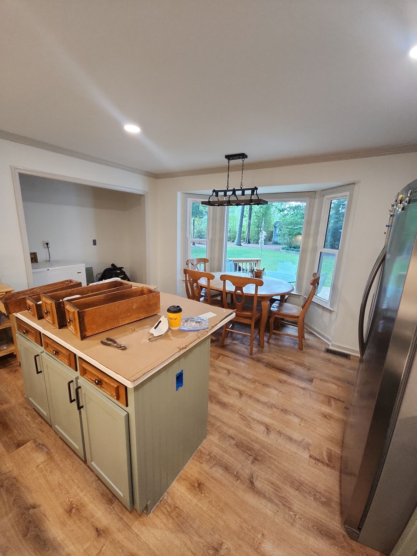 A Pathway to Personality – A Two-Tone Kitchen Transformation in Apex by Elite Remodeling and Design LLC