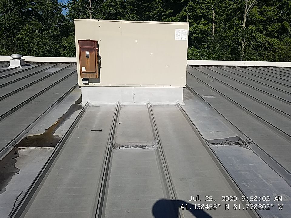 Commercial Metal Roof Coating by Gold Star Roofing LLC