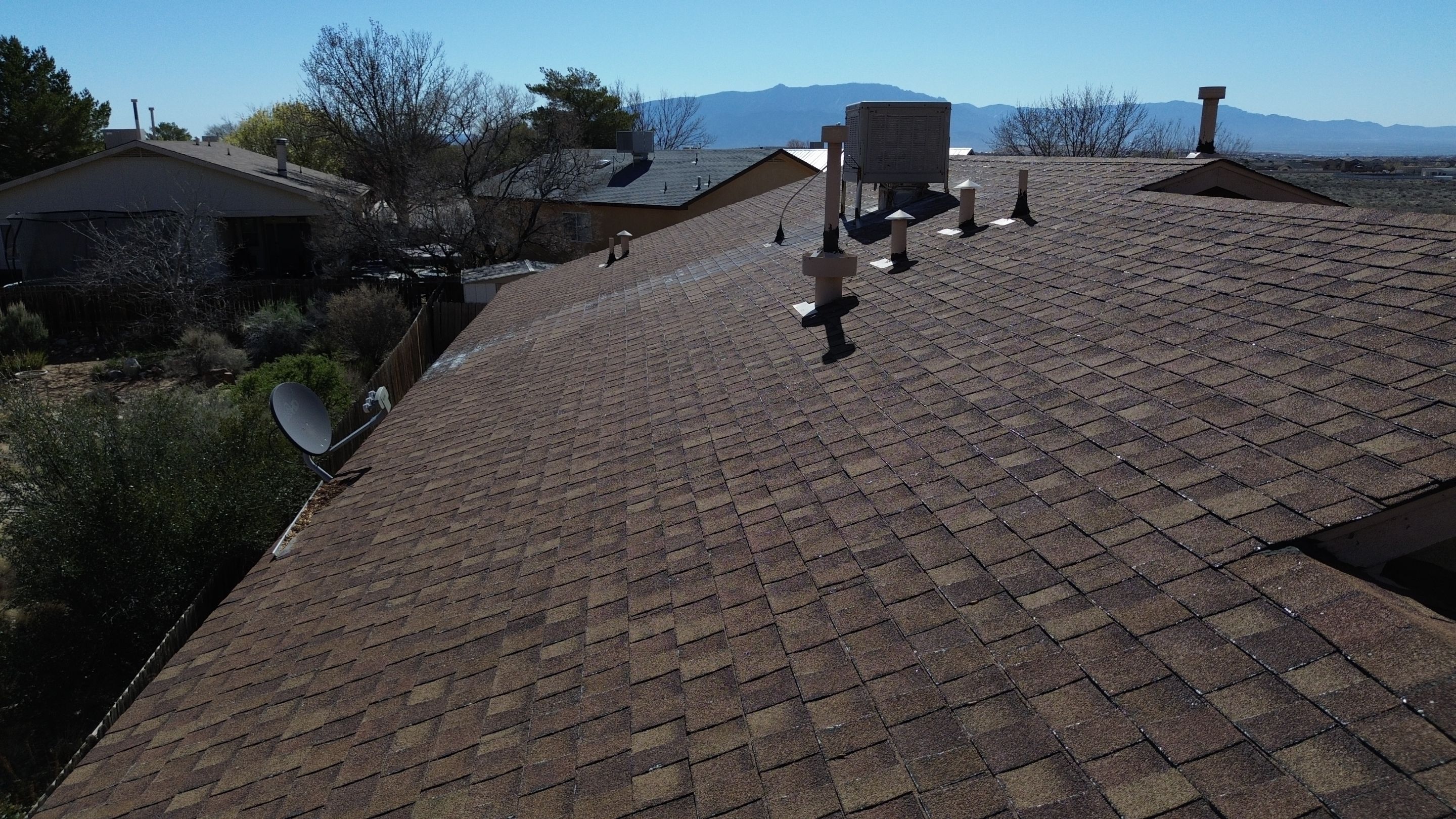 Oakridge Desert tan shingles in Chimayo Meadows by Doyle Roof Masters Inc