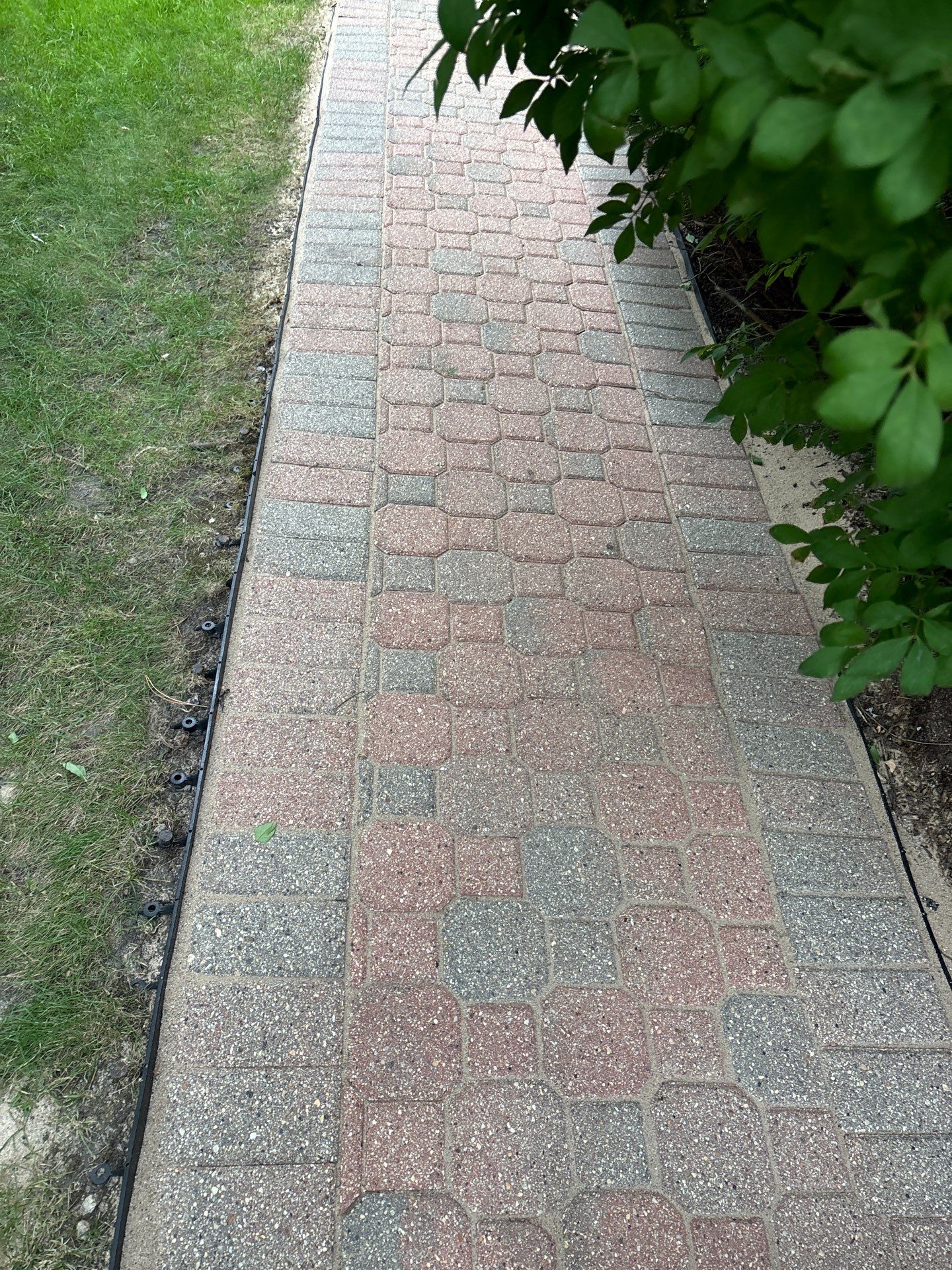 Brick paver repair, clean and seal by Northern Power Washing LLC.