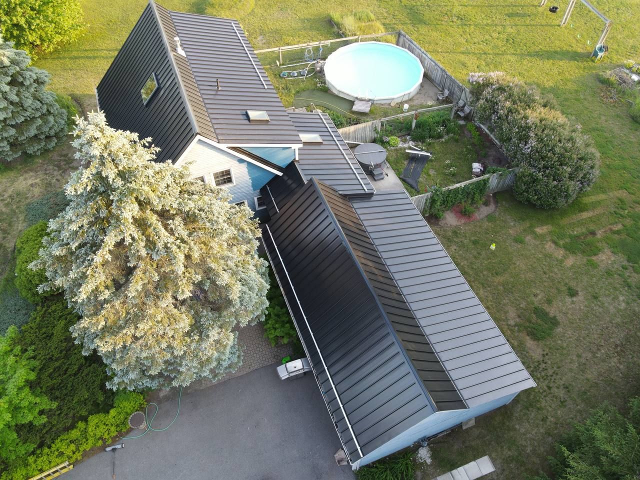 Residential Roofing Installation using 24 Ga Standing Seam Metal  by Jay Carter Roofing & Sheet Metal