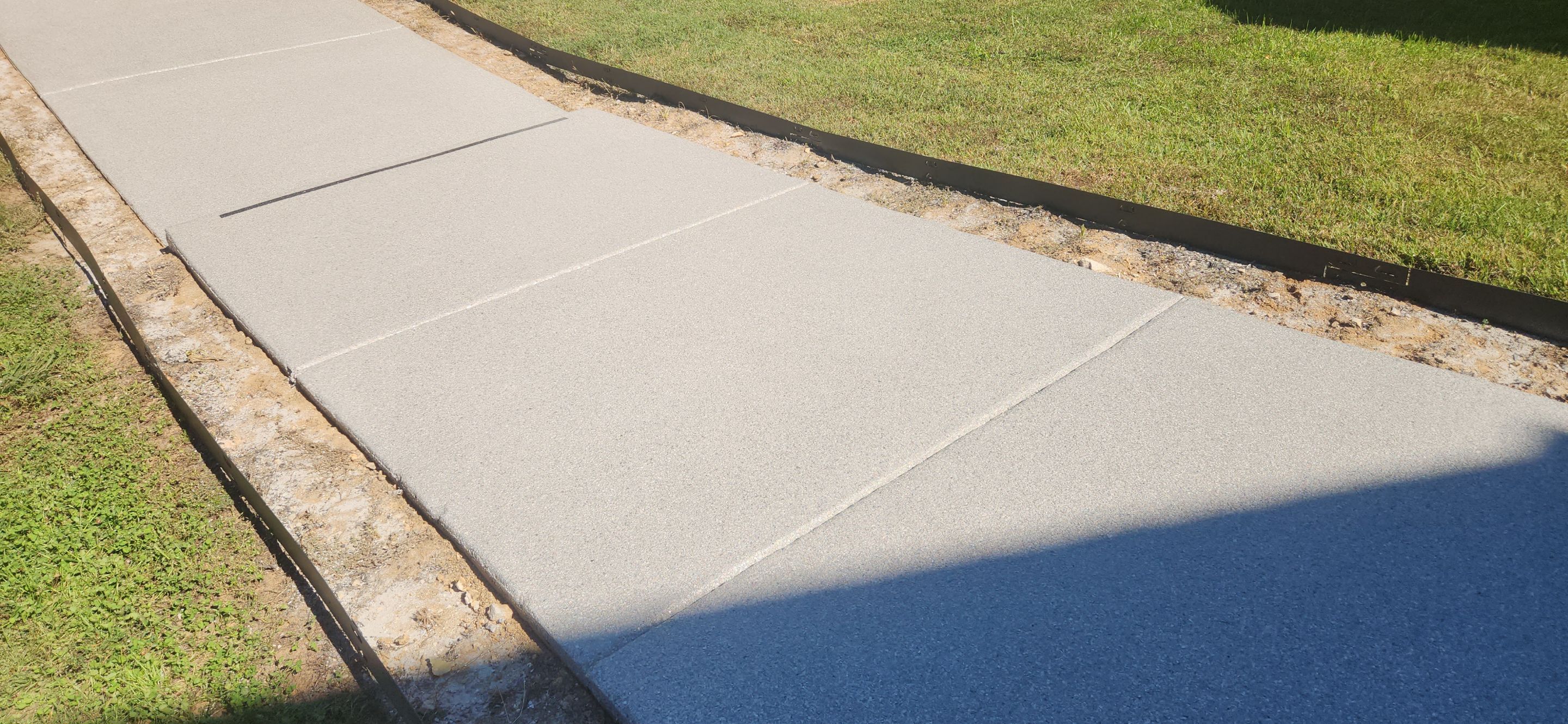 Front Porch and Garage using Coyote & Pumice by Elite Floor Solutions