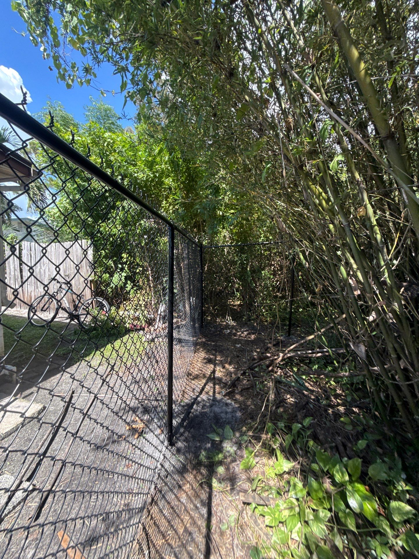 Black Chain Link Fence Installation and Site Clearing in Nokomis by True Fence LLC