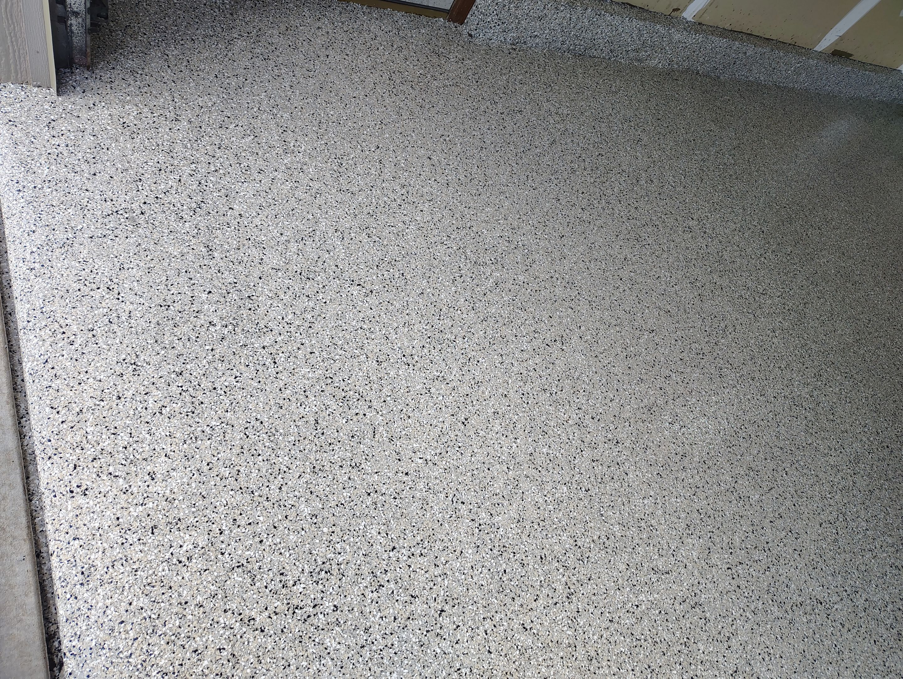 Multi-Car Garage Concrete Coating and Epoxy Finish in Sioux Falls by Select Painting, Coatings & Garage Cabinets
