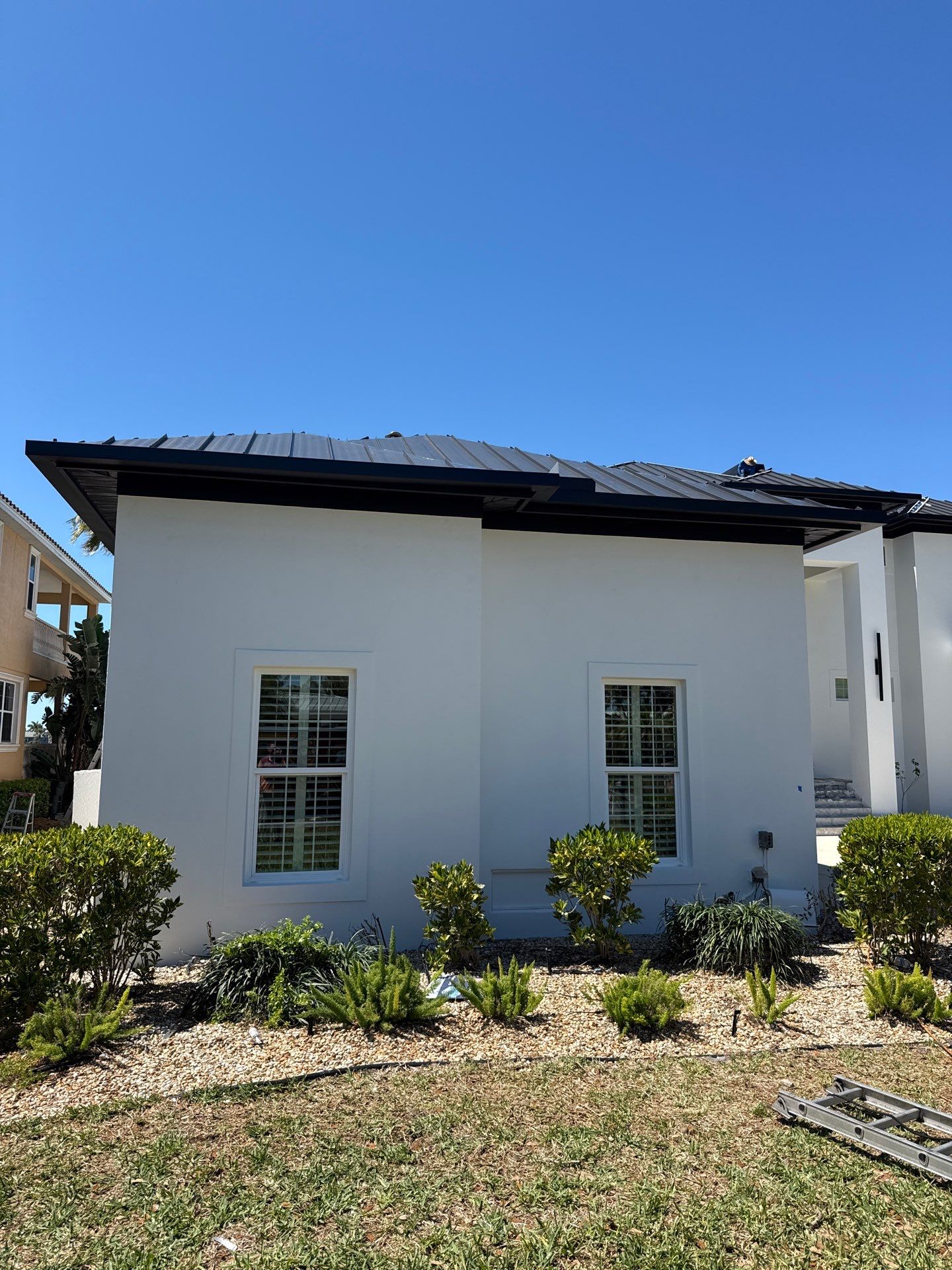 Soffit and Fascia Installation and black seamless gutters in Sarasota FL by Gutter Professors