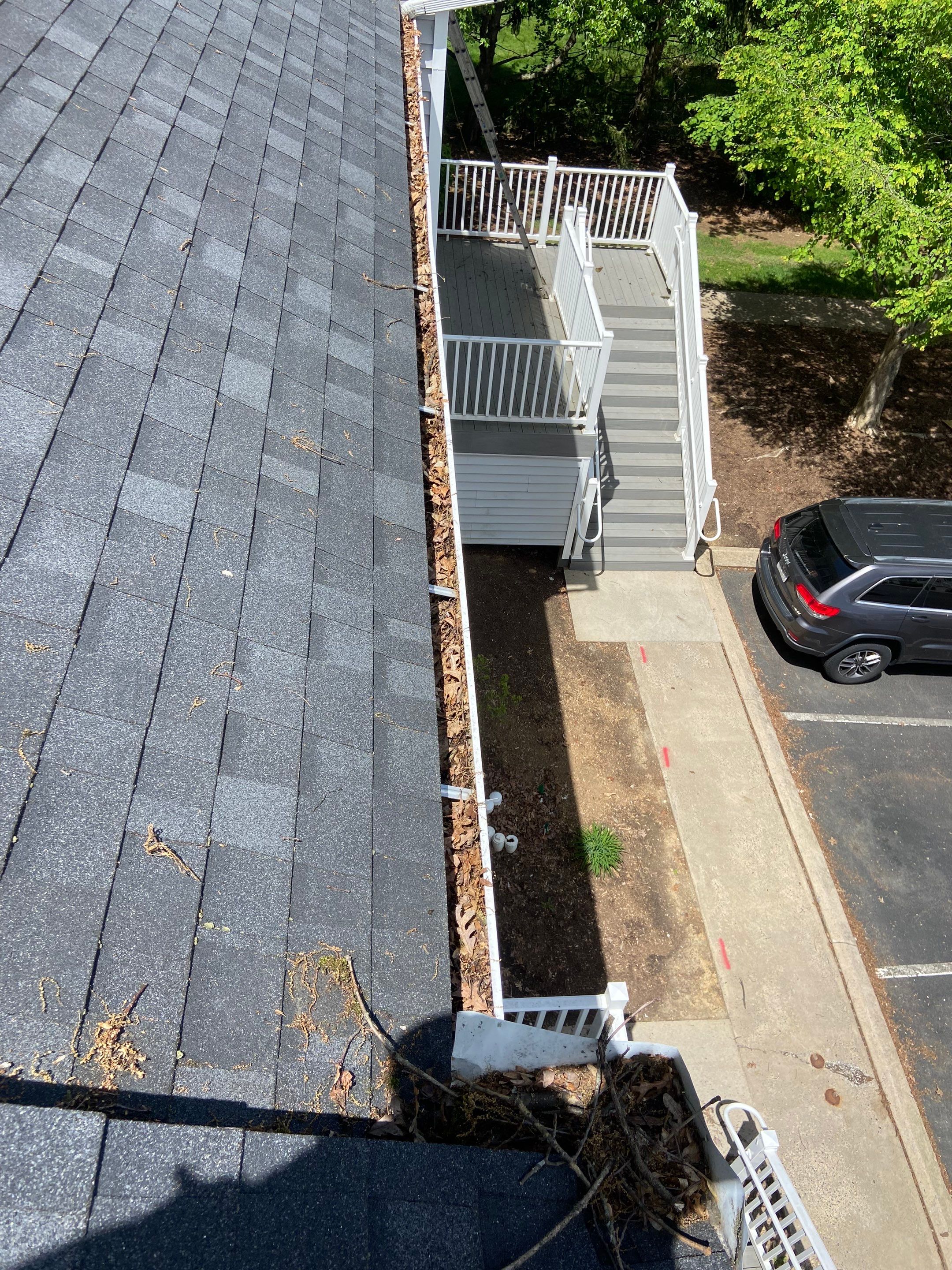 Commercial gutter cleaning State College, PA before photo with filled gutters
