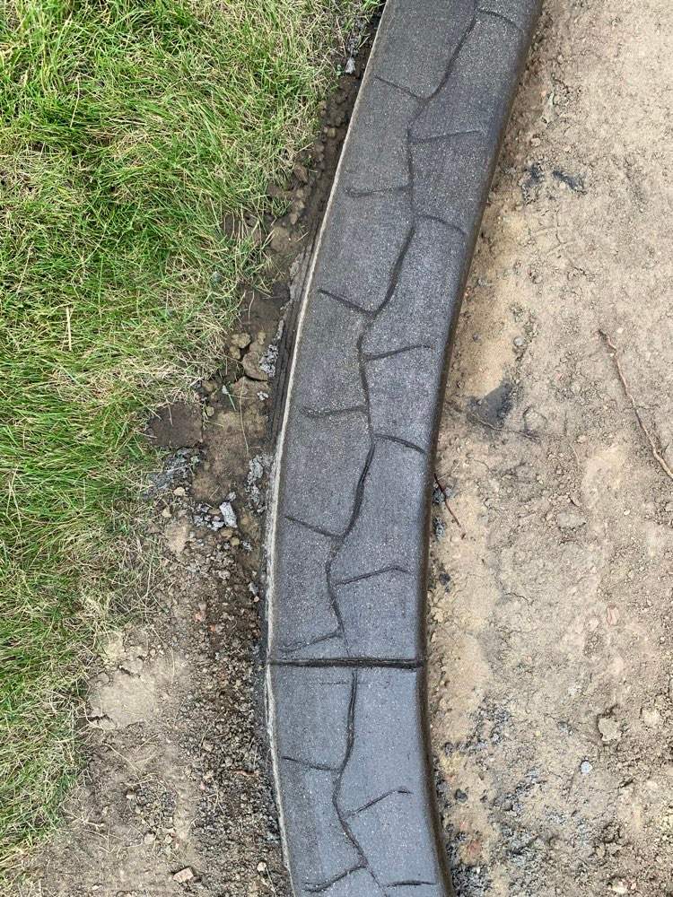 Decorative Stamped Concrete Garden Border Installation in Medicine Hat by Pump it Up Concrete Jacking